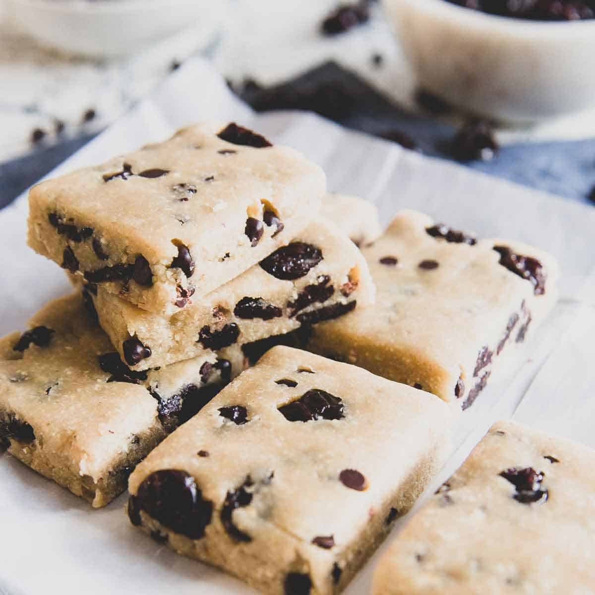 This healthier cookie dough bar recipe is made with a cashew, oat and coconut flour base then studded with chocolate chips and dried tart cherries.