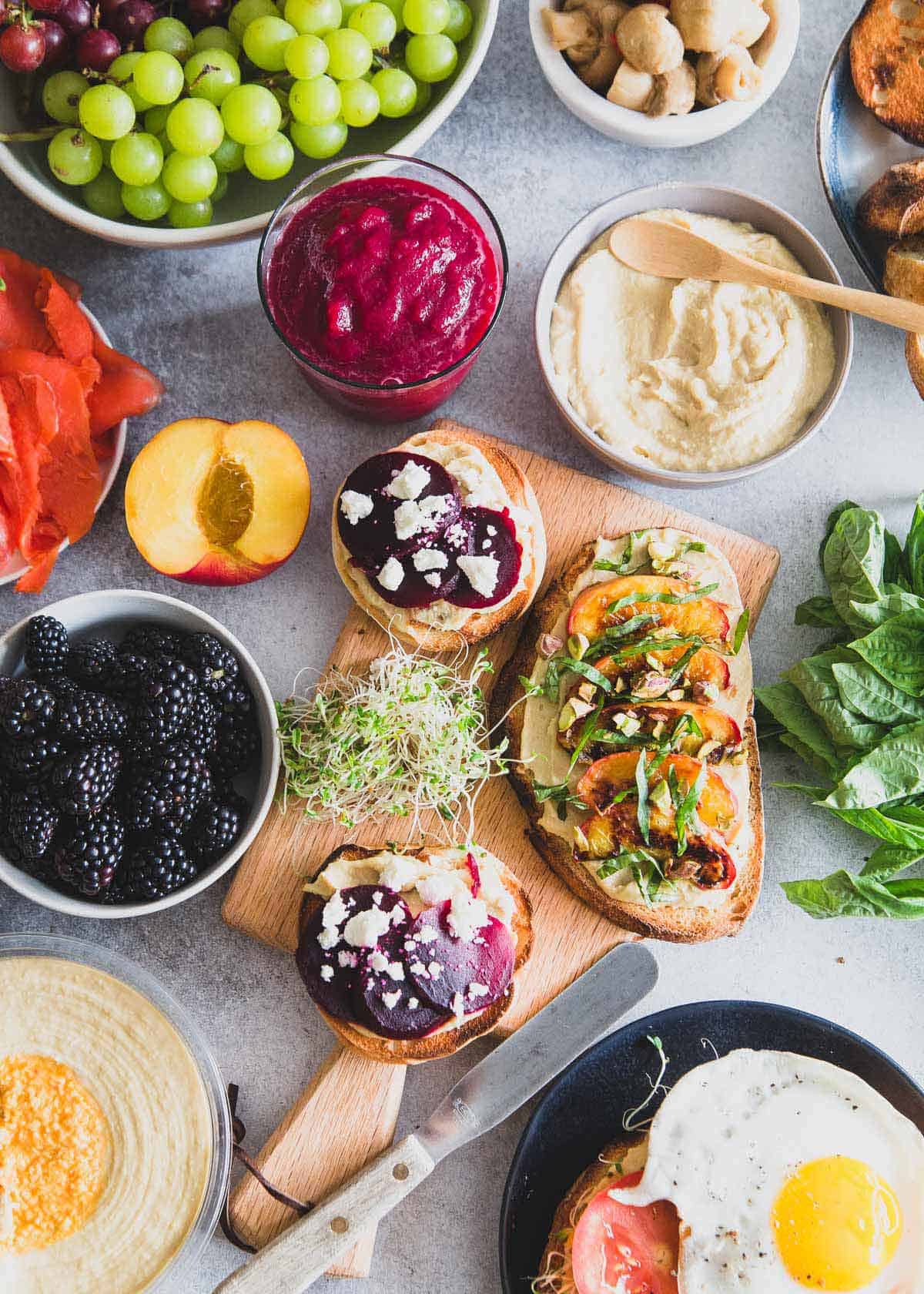 A healthy hummus toast brunch spread complete with a simple beet smoothie recipe to start the day.