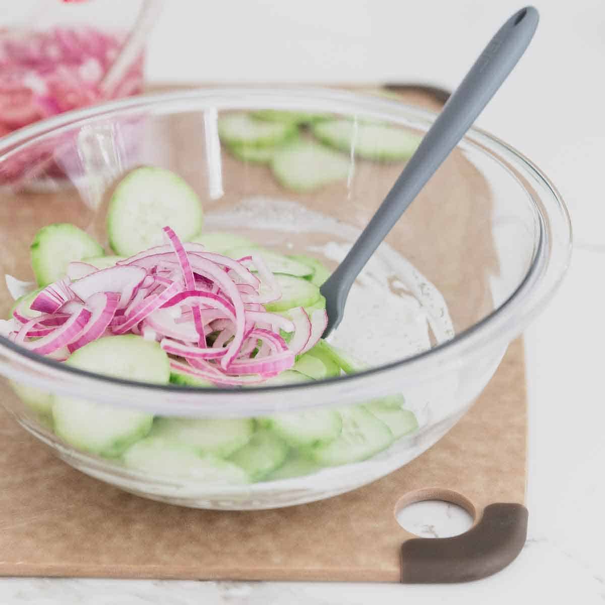 Quick pickled red onions add the perfect tangy flavor to this creamy cucumber dill salad recipe.