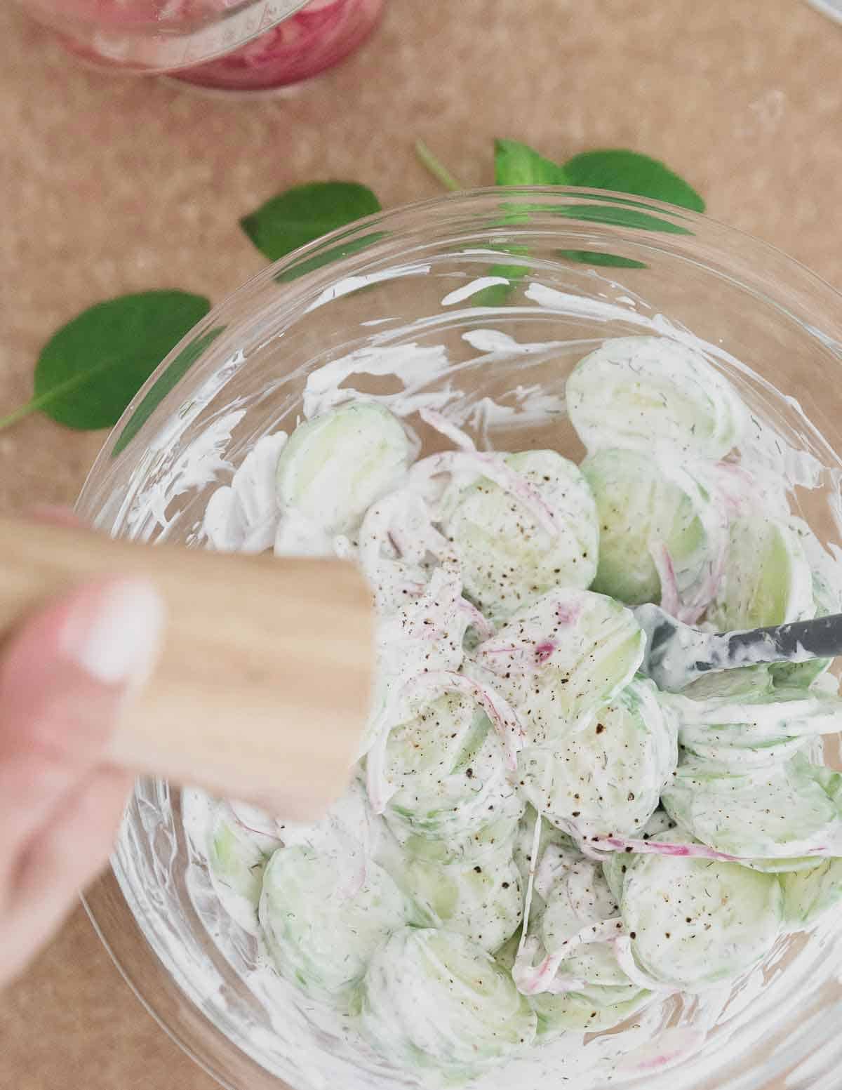 Simple seasonings like garlic, dill, salt and pepper are all you need for this creamy cucumber and onion salad recipe.