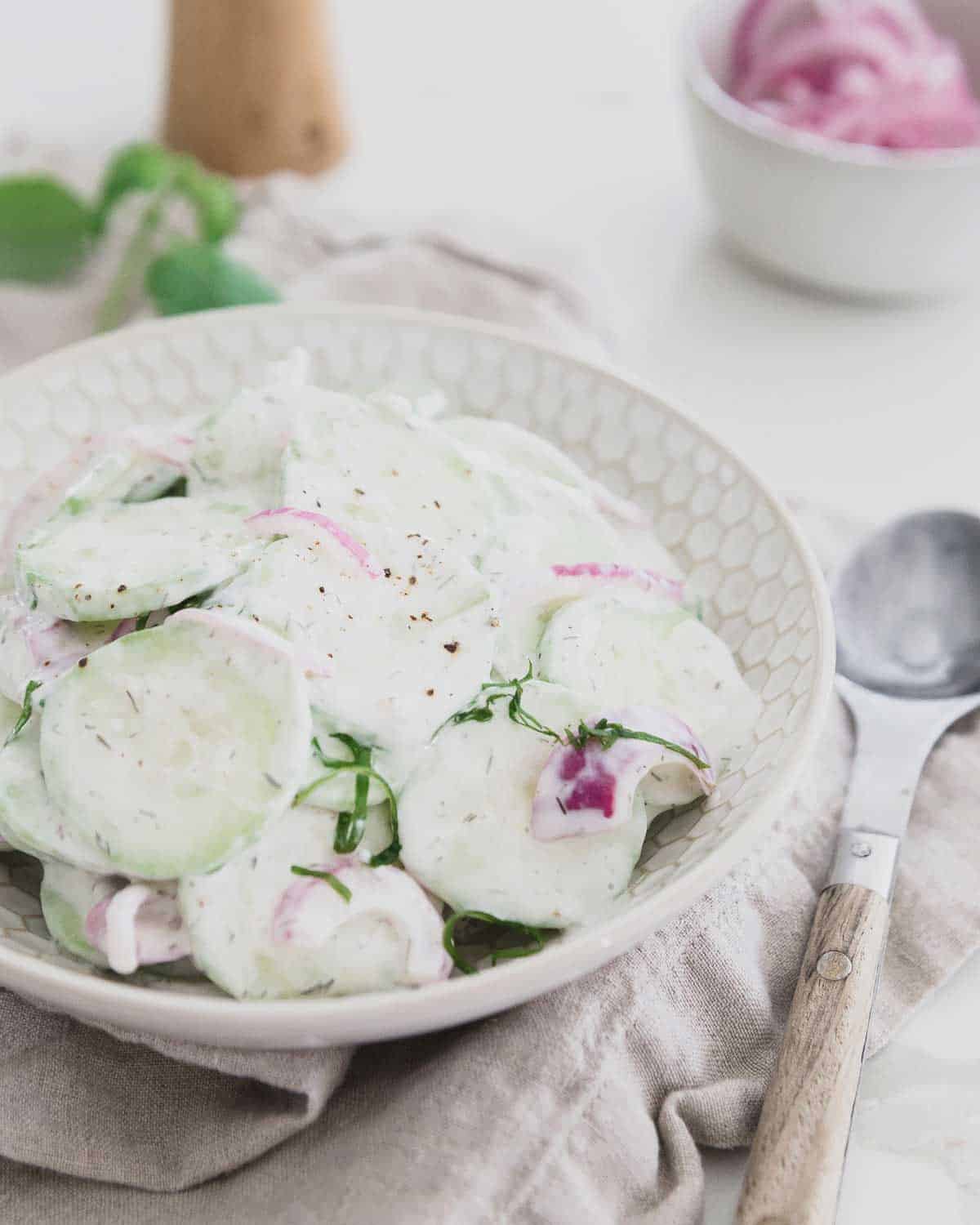 Skip the sour cream and mayo and try Greek yogurt in this healthier creamy cucumber salad recipe.