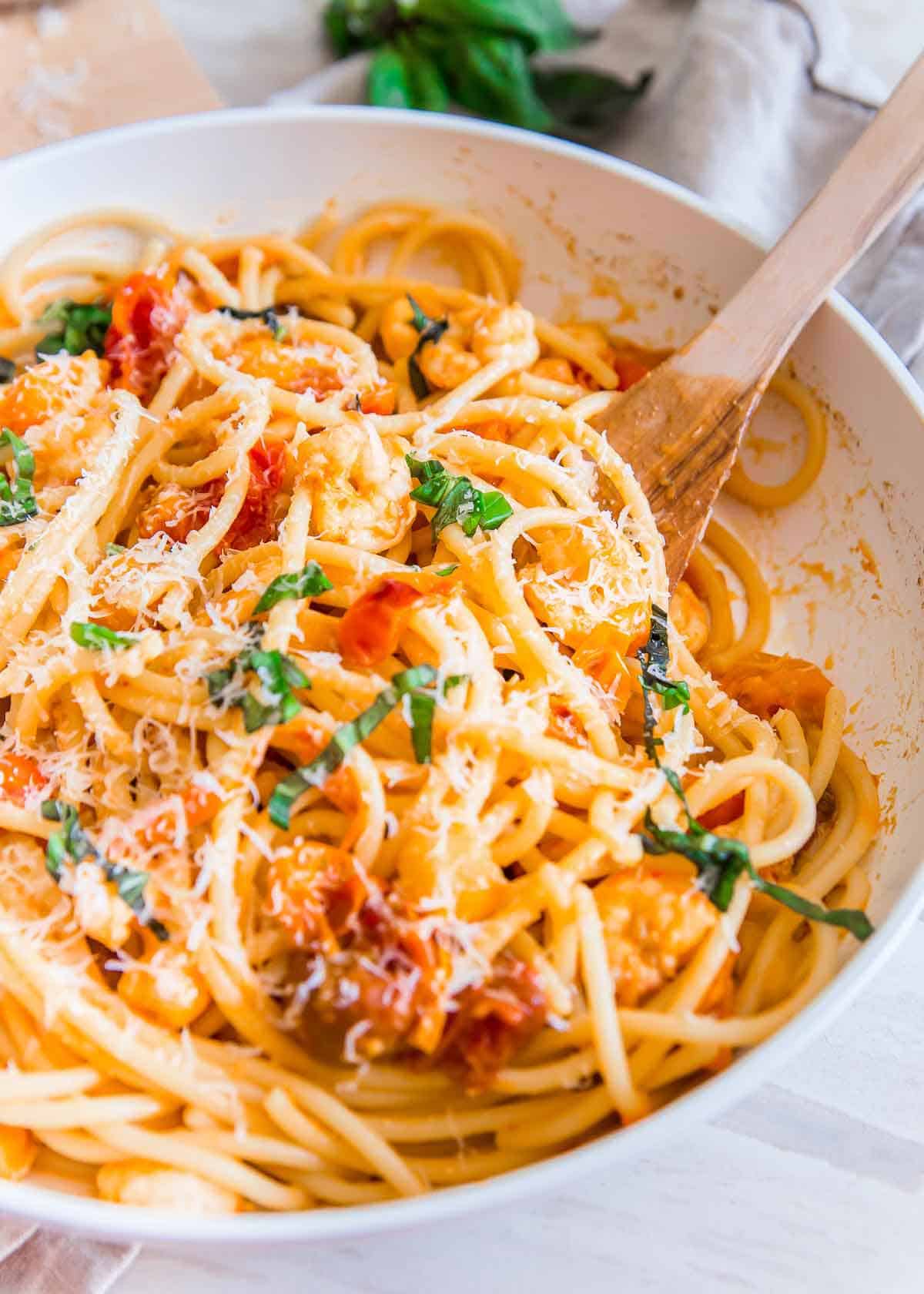 An easy pasta dinner using bucatini, frozen shrimp and cherry tomatoes. 