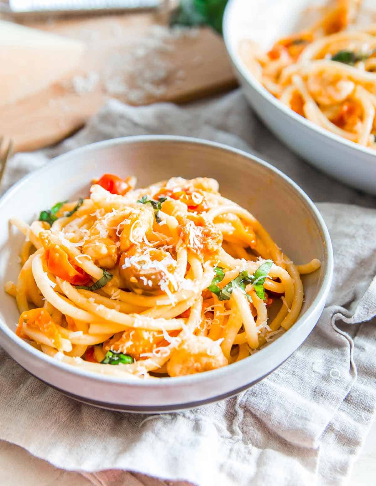 Looking for an easy weeknight meal? Grab some frozen shrimp, cherry tomatoes and a box of pasta from the pantry for this bucatini with garlic shrimp recipe.