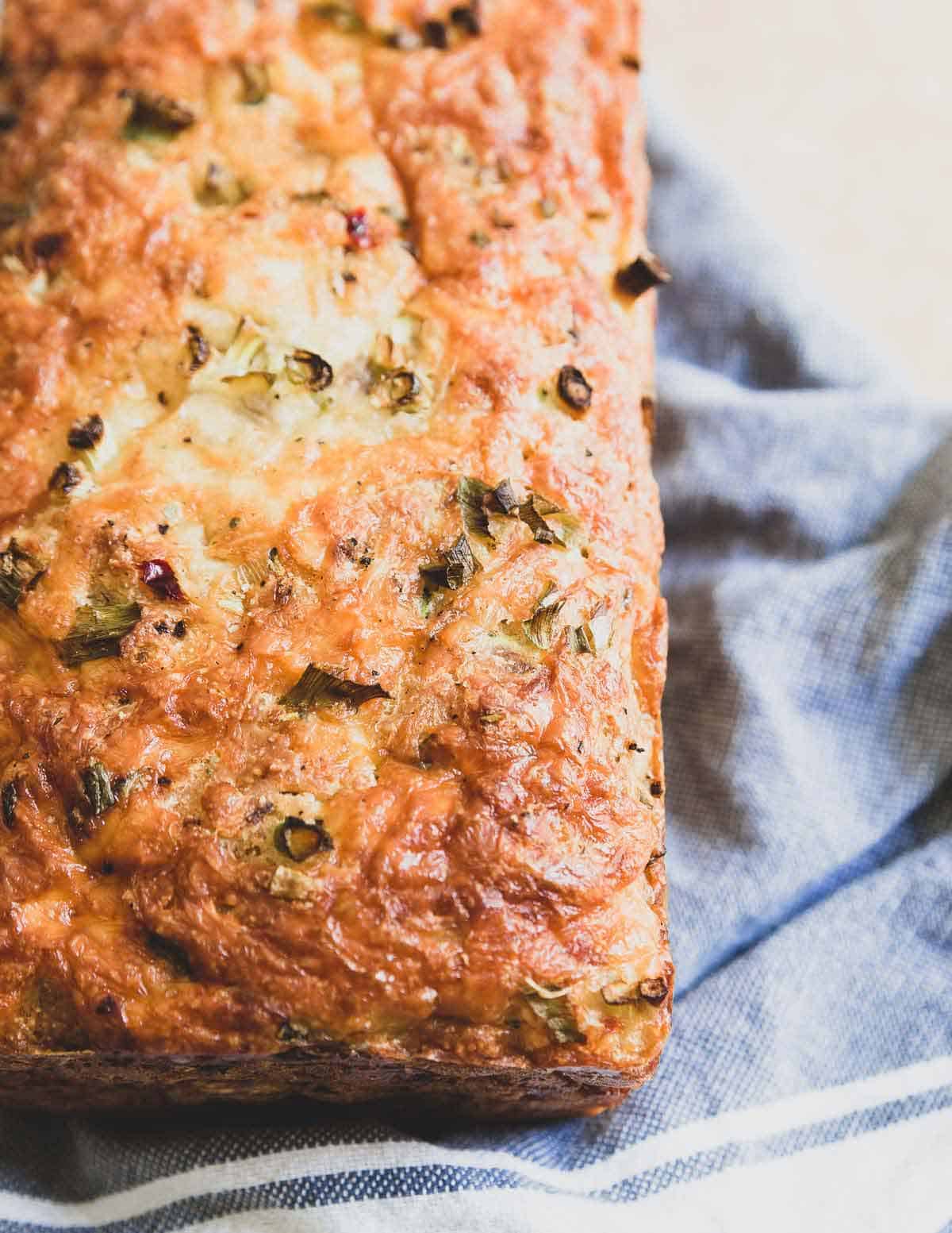 This cheesy zucchini bread is hearty, savory and filled with pepper jack cheese. The perfect way to use up fresh summer zucchini!