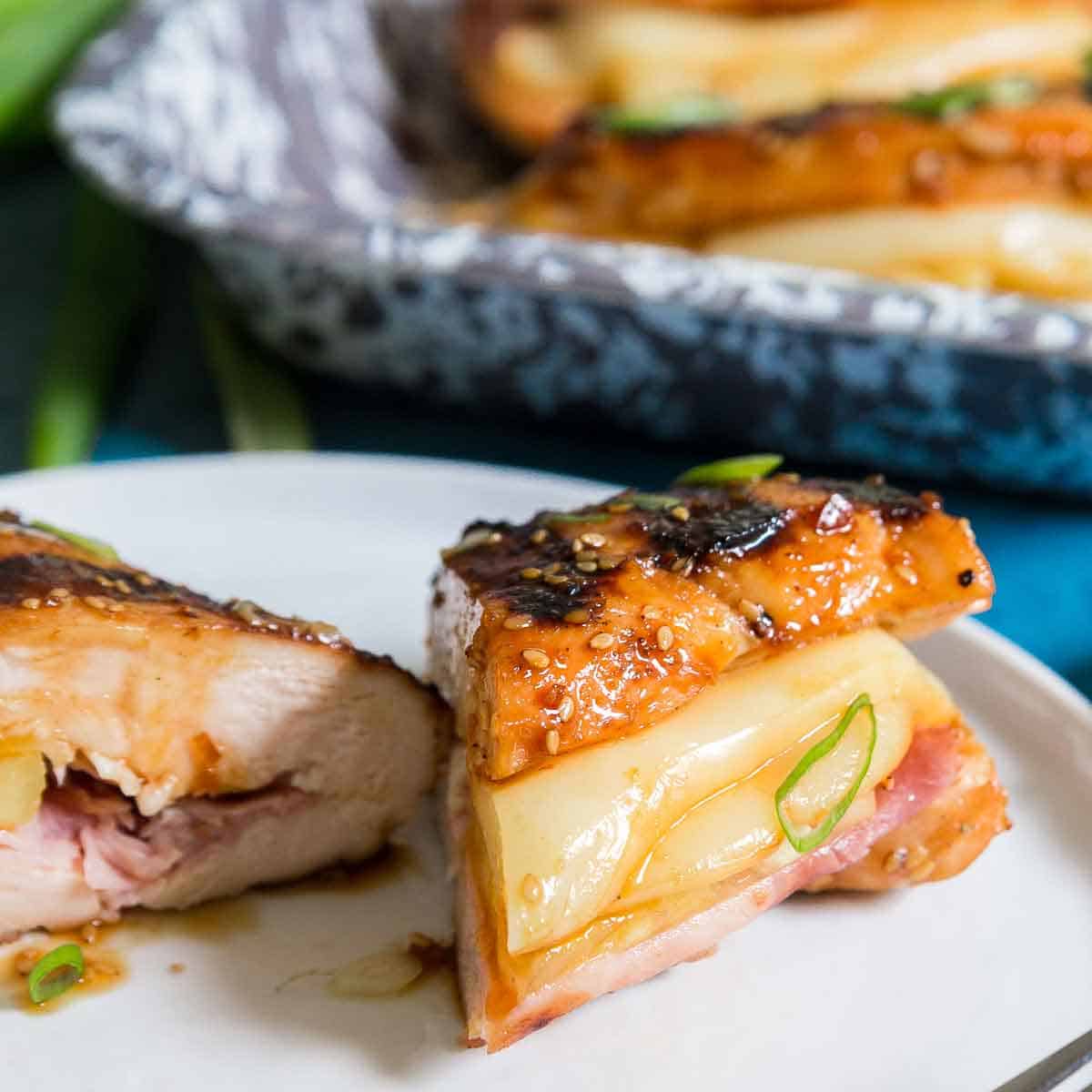 Hawaiian teriyaki chicken is stuffed with pineapple, ham and cheese and made on the grill.