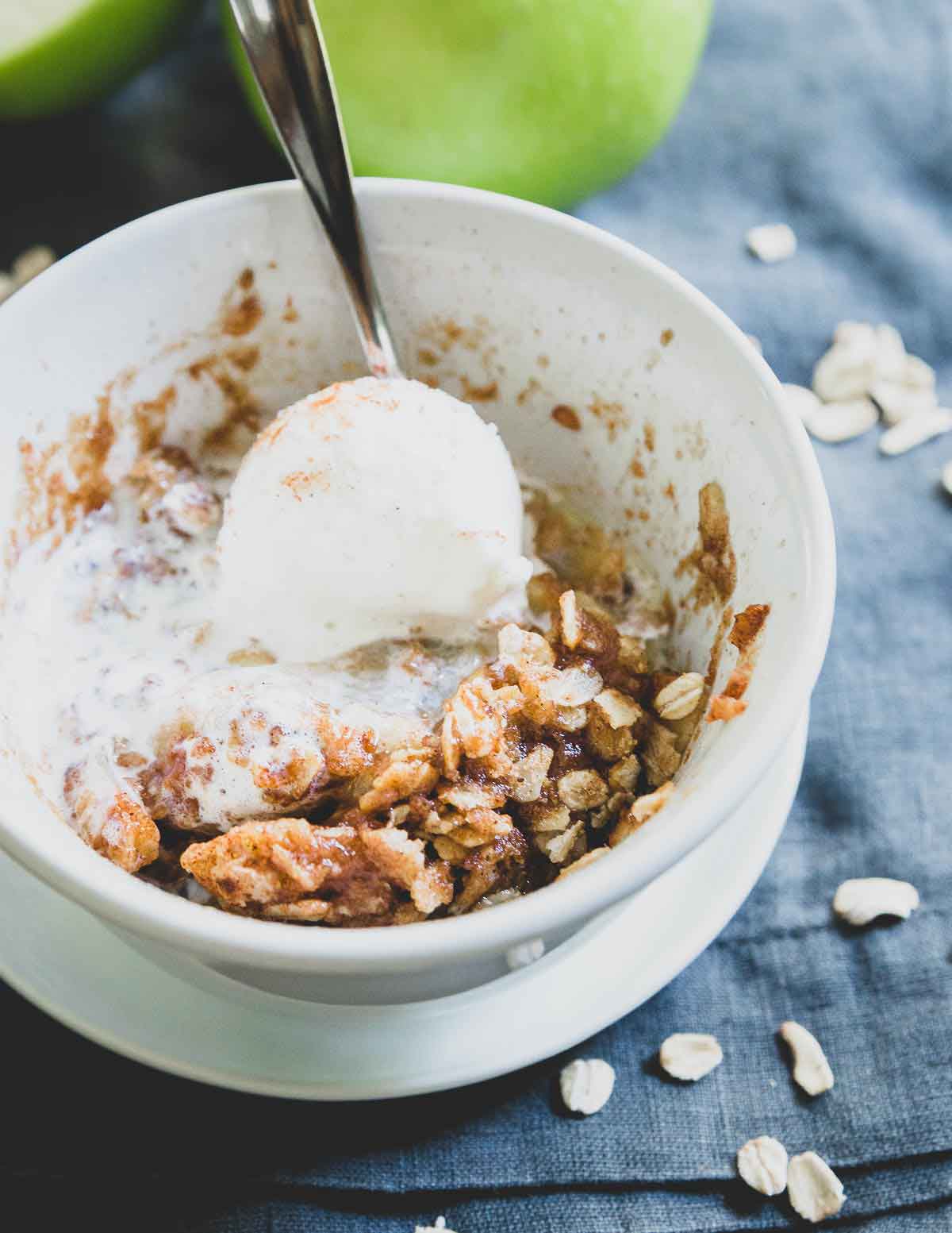 Top this single serve microwave apple crisp recipe with a scoop of vanilla ice cream and enjoy!