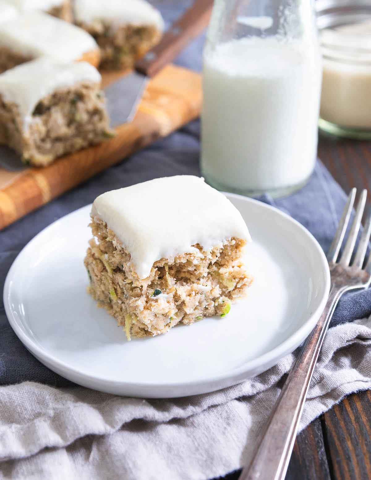 These zucchini bars use healthier, gluten-free ingredients, less sugar and less oil than the classic recipe with a better for you cream cheese icing too!