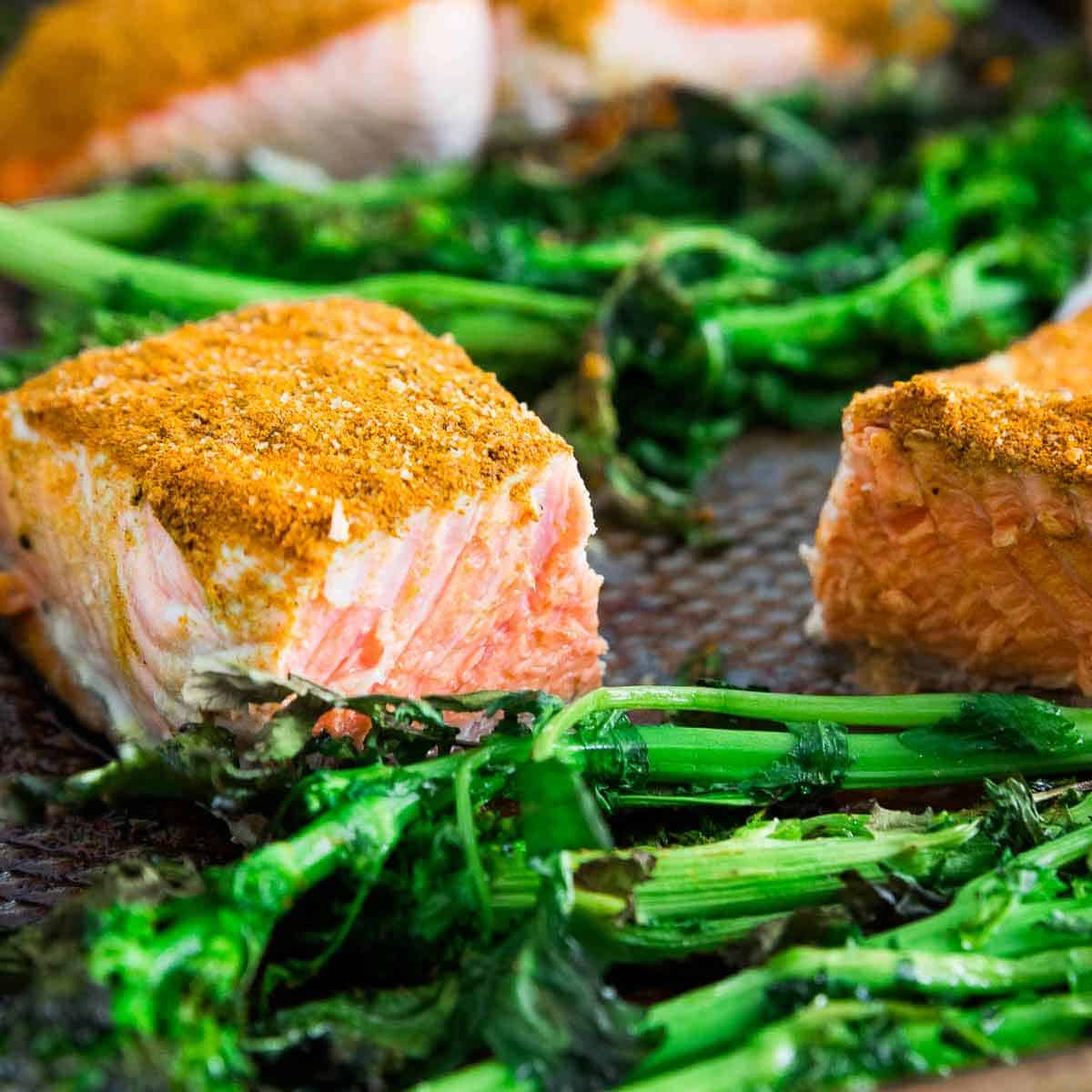 Sheet pan cinnamon turmeric wild salmon cooked with broccoli rabe on a sheet pan is a healthful dinner option and ready in no time!