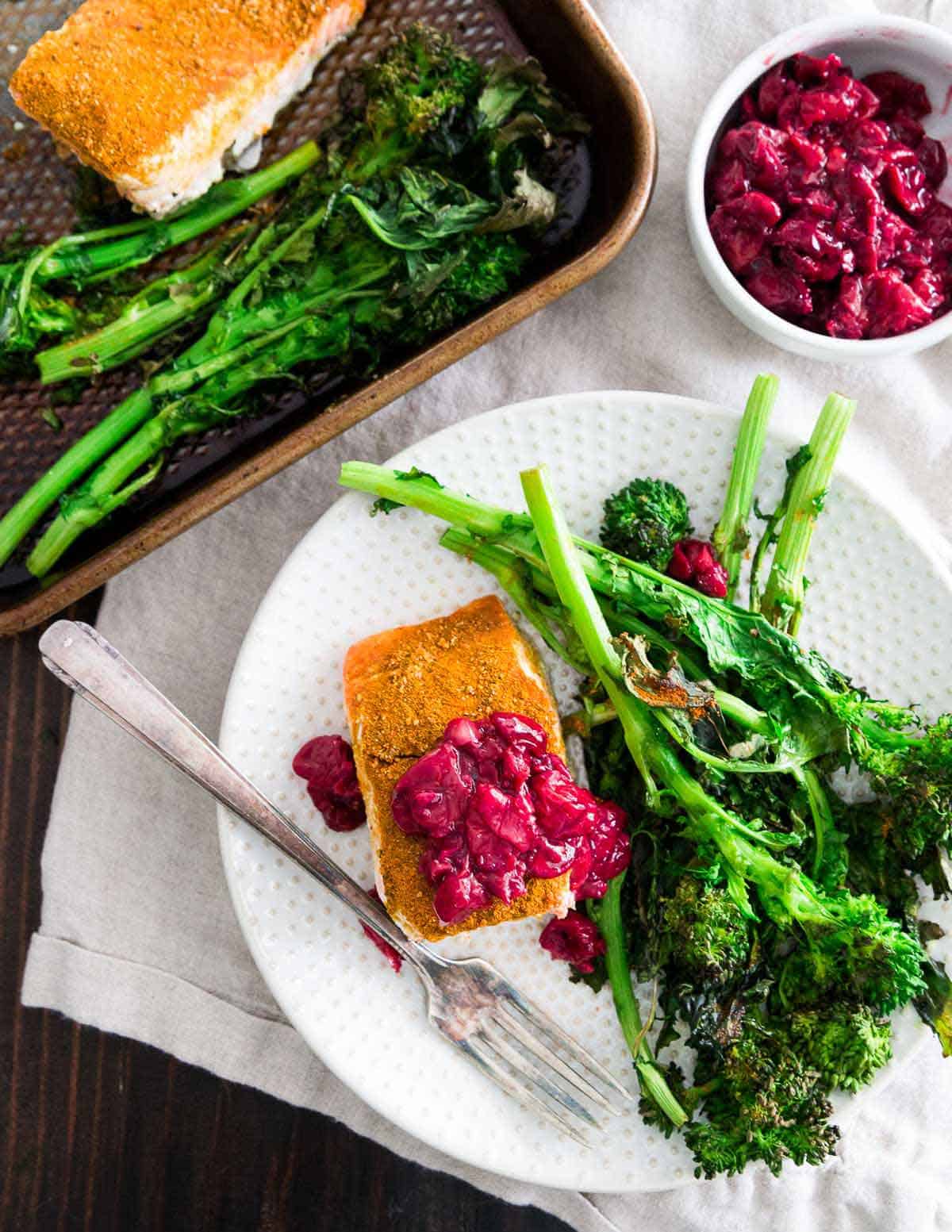 This sheet pan turmeric salmon with a quick garlic cherry sauce and roasted broccoli is a wholesome, healthy and anti-inflammatory dinner recipe that's super easy to put together.