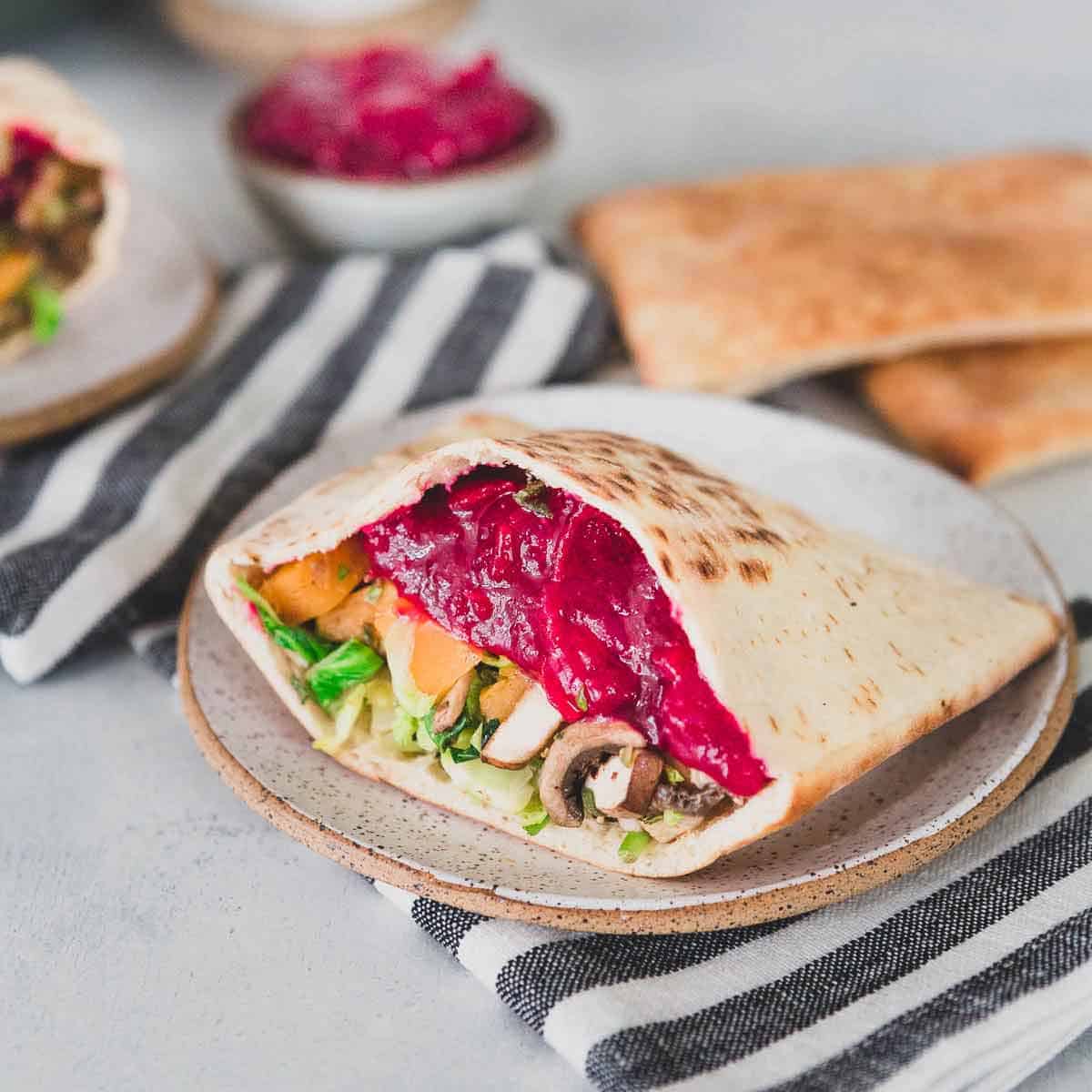 Make this easy cranberry vegetable sandwich using leftover Thanksgiving ingredients. It's an easy, vegetarian way to enjoy leftovers in a healthier way after a day of indulgence.