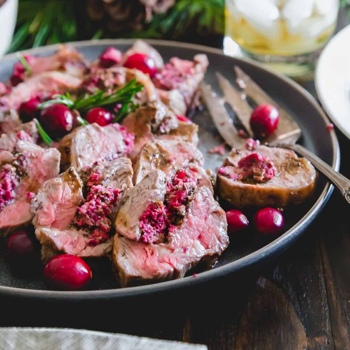Gorgeous cranberry pesto stuffed lamb is the perfect dish for a holiday feast!