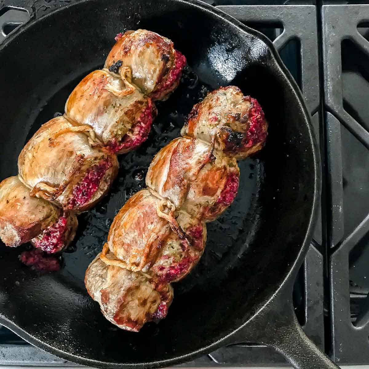 Pan seared rolled and tied lamb stuffed with cranberry pesto.