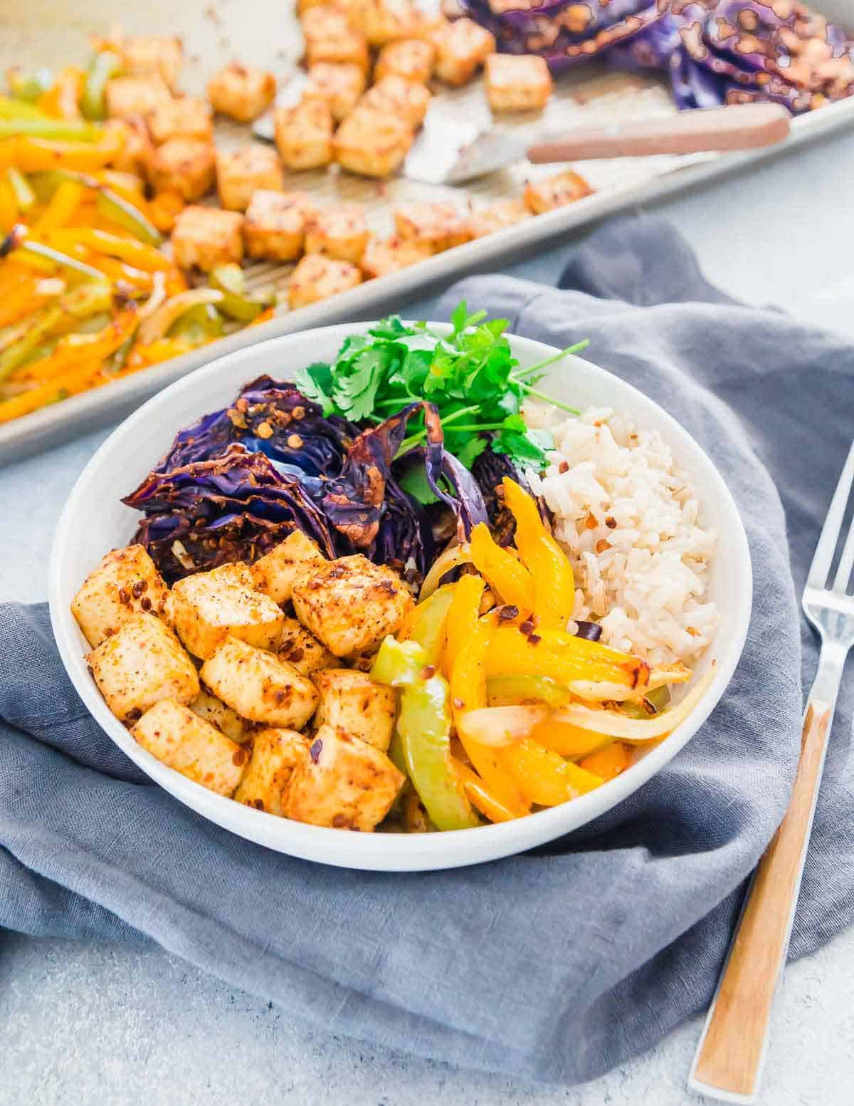 This sheet pan recipe for roasted tofu, cabbage & peppers is an easy way to meal prep a healthy and nutritious vegetarian meal to enjoy throughout the week.