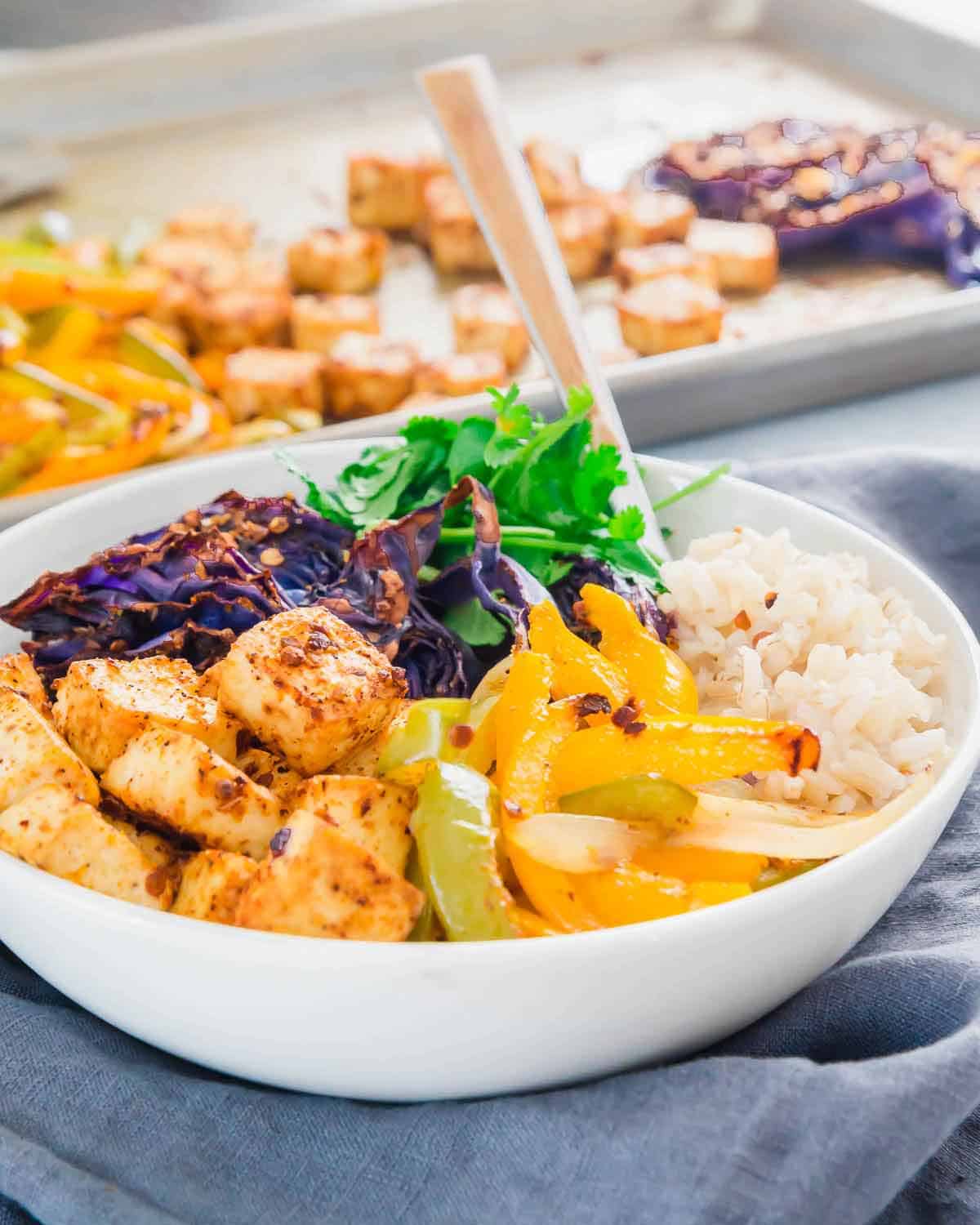 Try this easy roasted tofu meal prep recipe made entirely on a sheet pan for easy meals throughout the week.