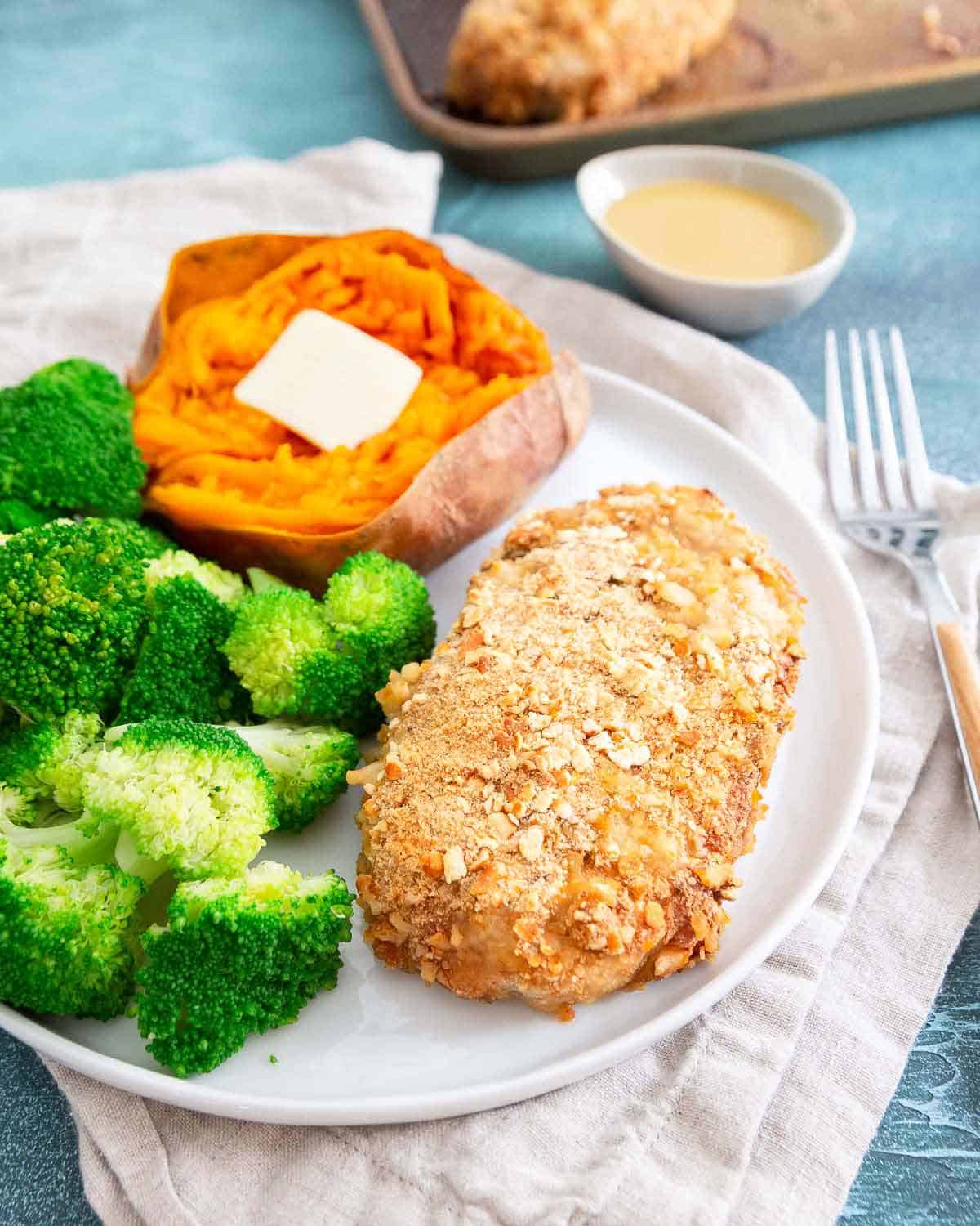 These baked pretzel crusted pork chops with an easy maple dijon sauce are an easy and healthy dinner packed with lean protein.