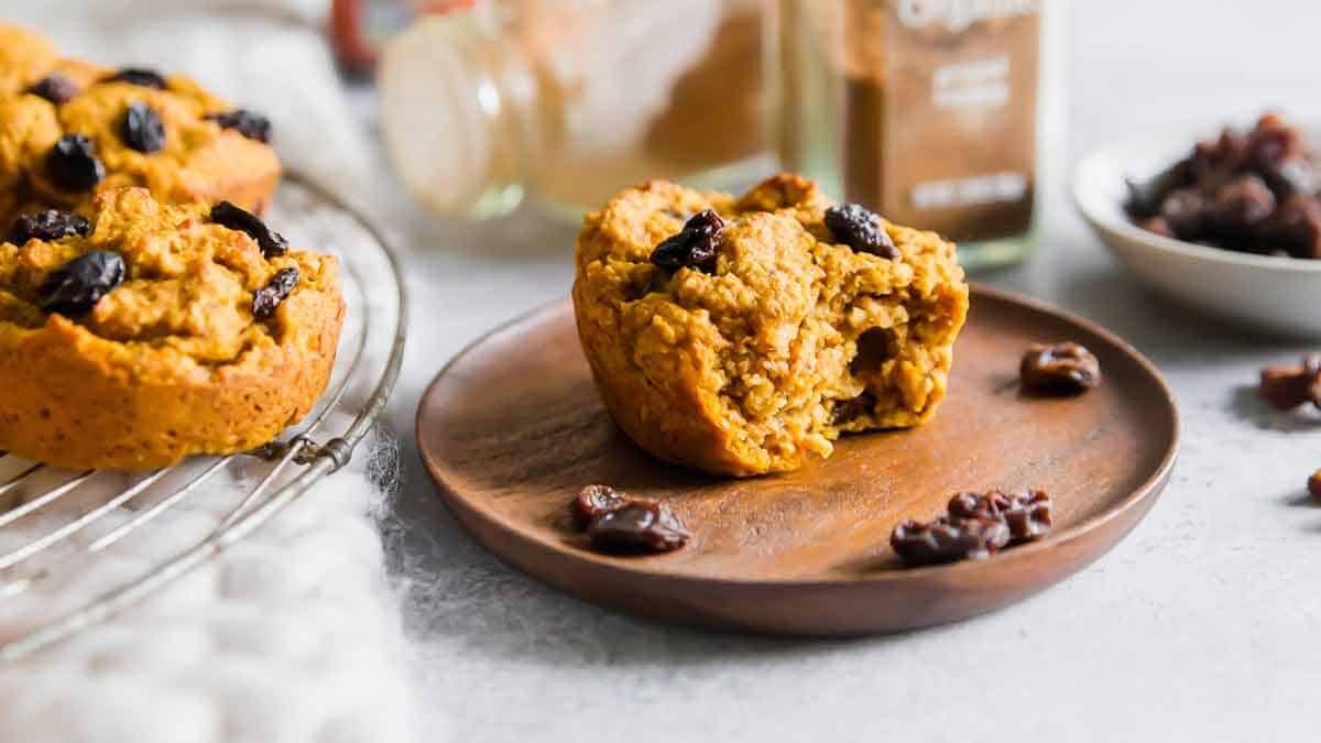 Sweet potato bran muffin on a wooden plate.