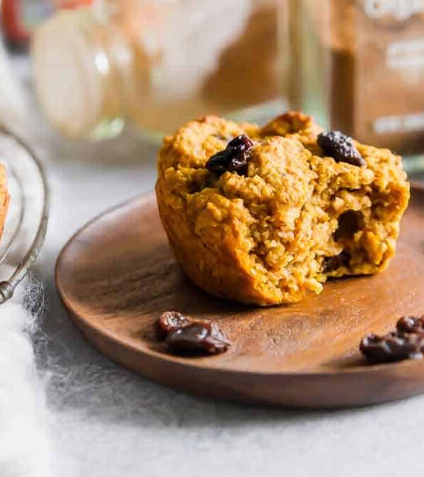 Sweet potato bran muffin on a wooden plate.
