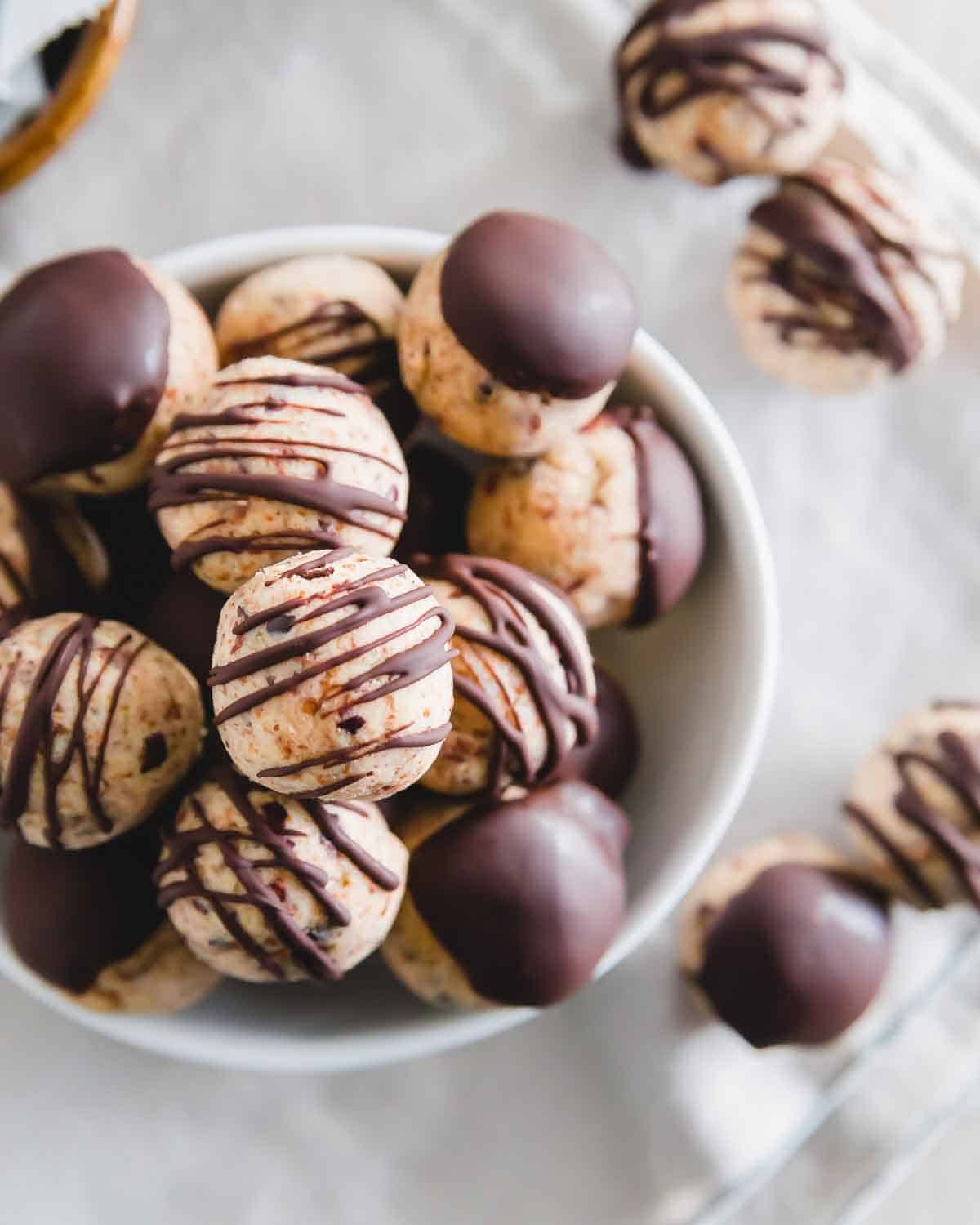 Healthy cookie dough bites made from leftover almond pulp (from making homemade almond milk) are such an easy treat so that nothing goes to waste. Don't worry - you can make these with almond flour too if you don't have almond pulp. Drizzled or dipped in chocolate, they're the ultimate vegan/gluten-free treat!