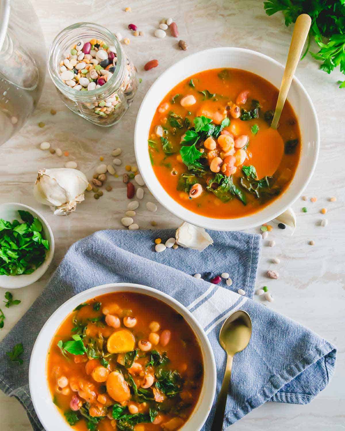 13 bean and lentil mixed soup made in the Instant Pot with kale and a brothy tomato base.