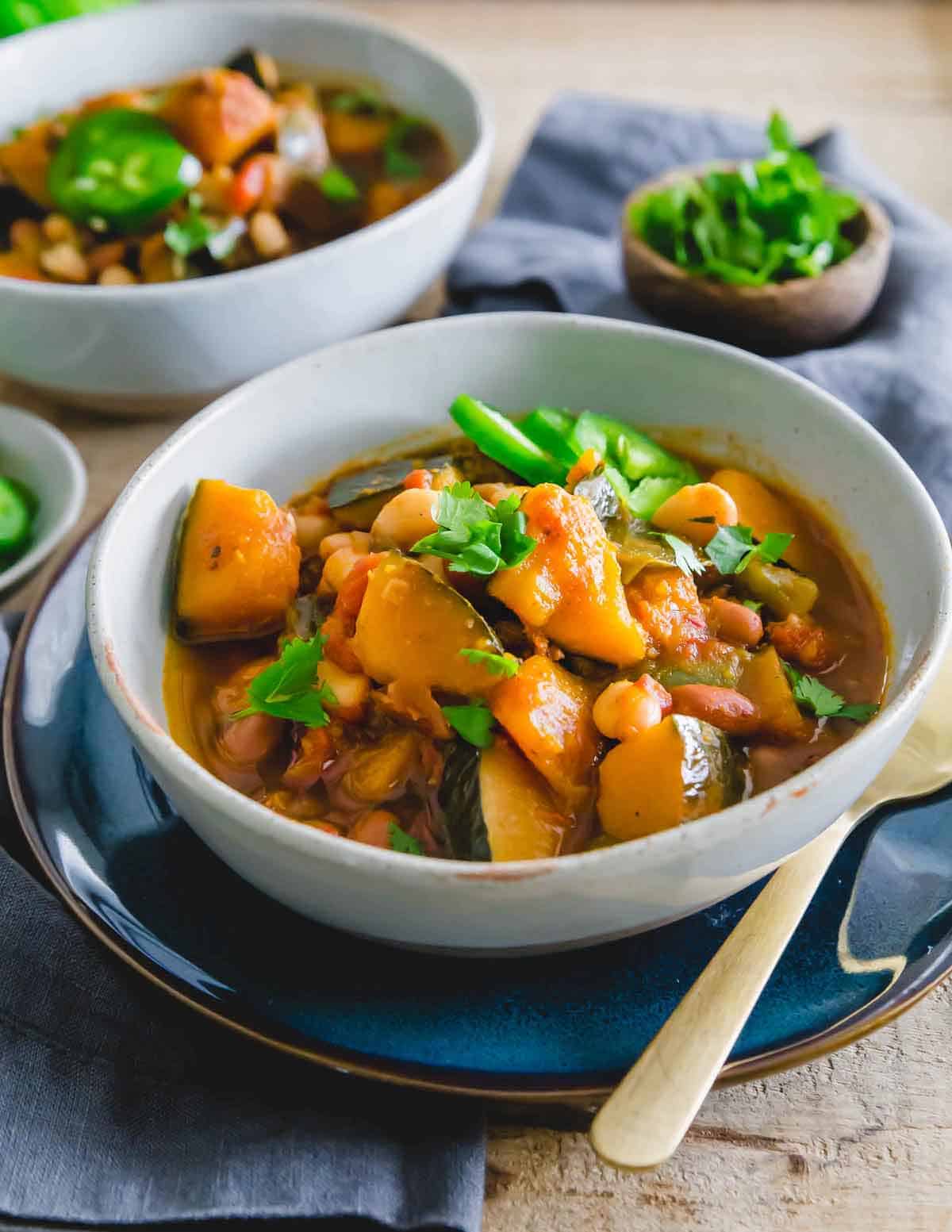 Kabocha squash chili made in the slow cooker is a hearty vegetarian chili that's filling, flavorful and great in the colder months when you can find kabocha squash in season.