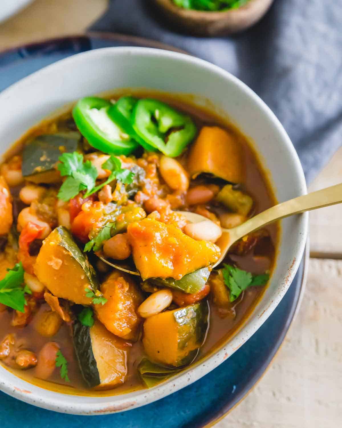 Vegetarian white bean chili with kabocha squash is the perfect warm and filling winter meal.