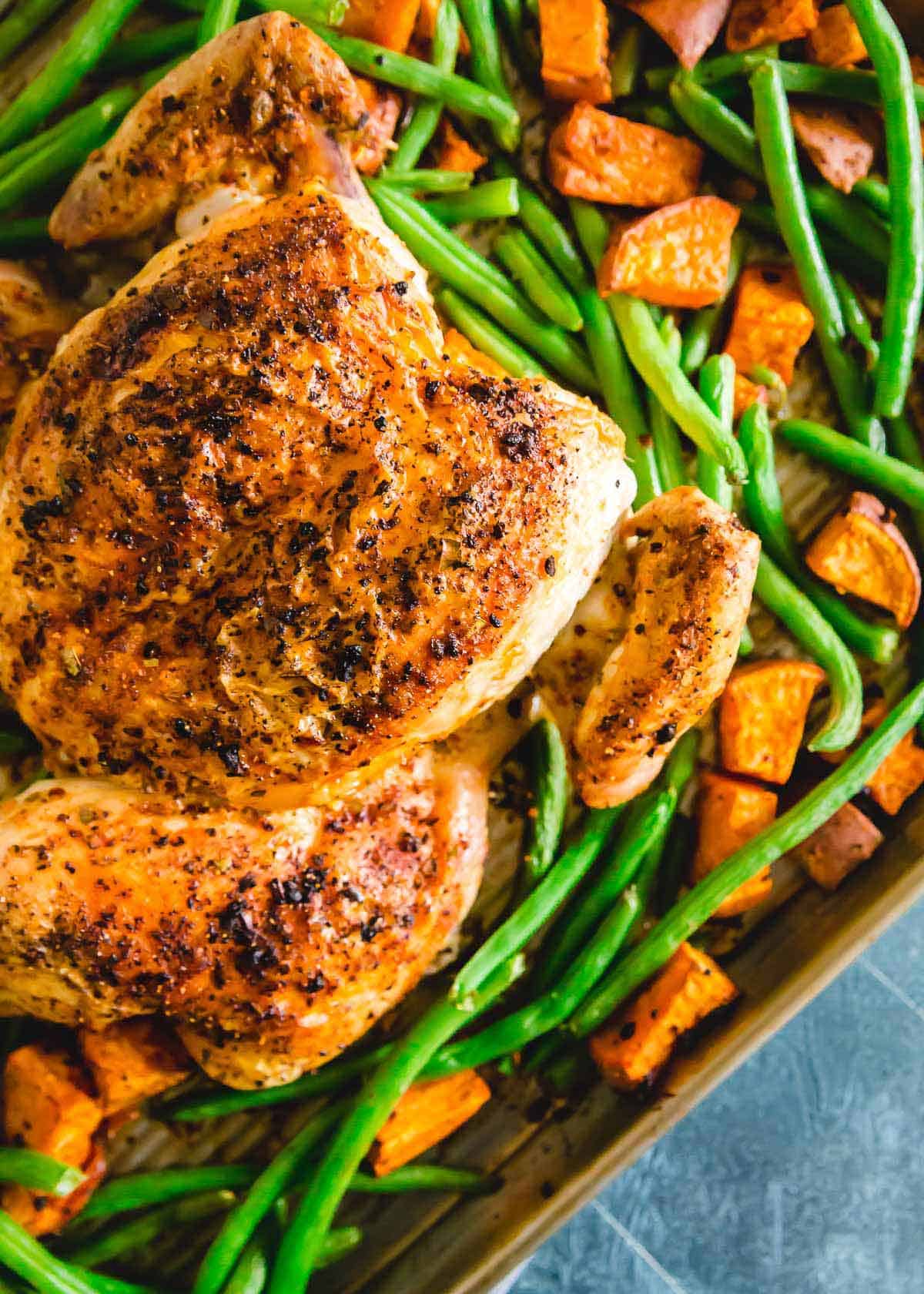 Spatchcock piri piri roasted chicken recipe with green beans and sweet potatoes.