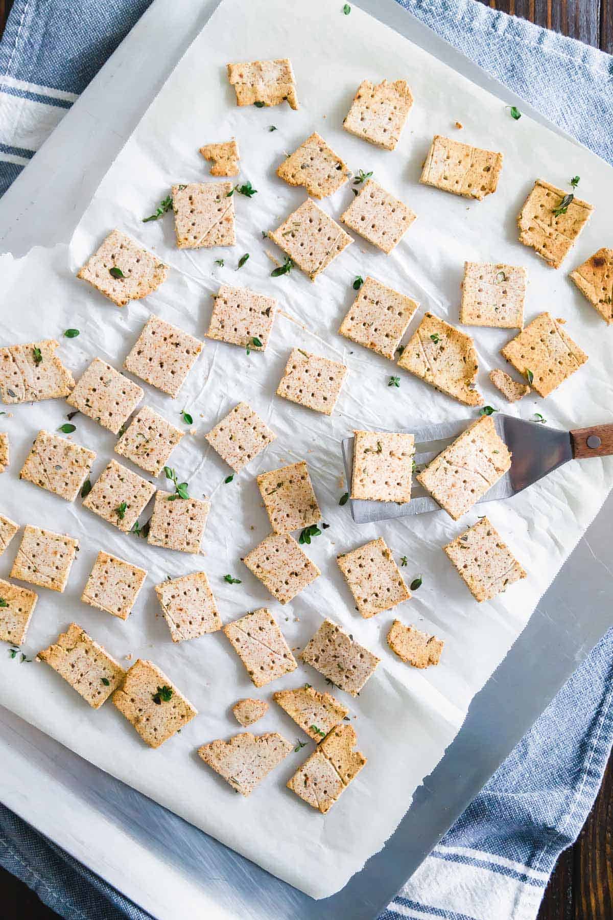 Crispy baked almond pulp crackers are an easy vegan, gluten-free and paleo recipe for using up leftover almond pulp.