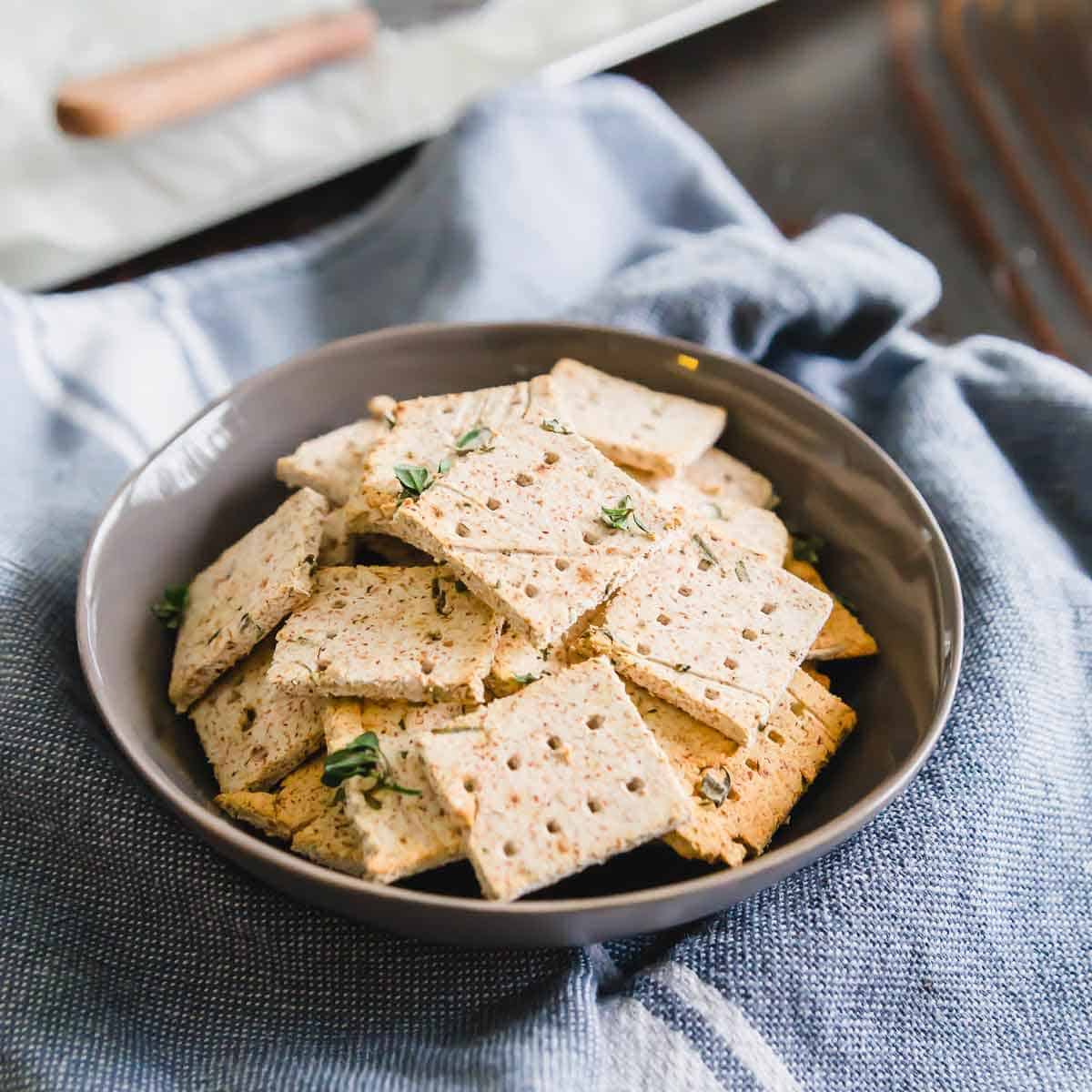 Use up leftover almond pulp from making almond milk and repurpose it into these easy vegan almond pulp crackers flavored with simple herbs and spices.