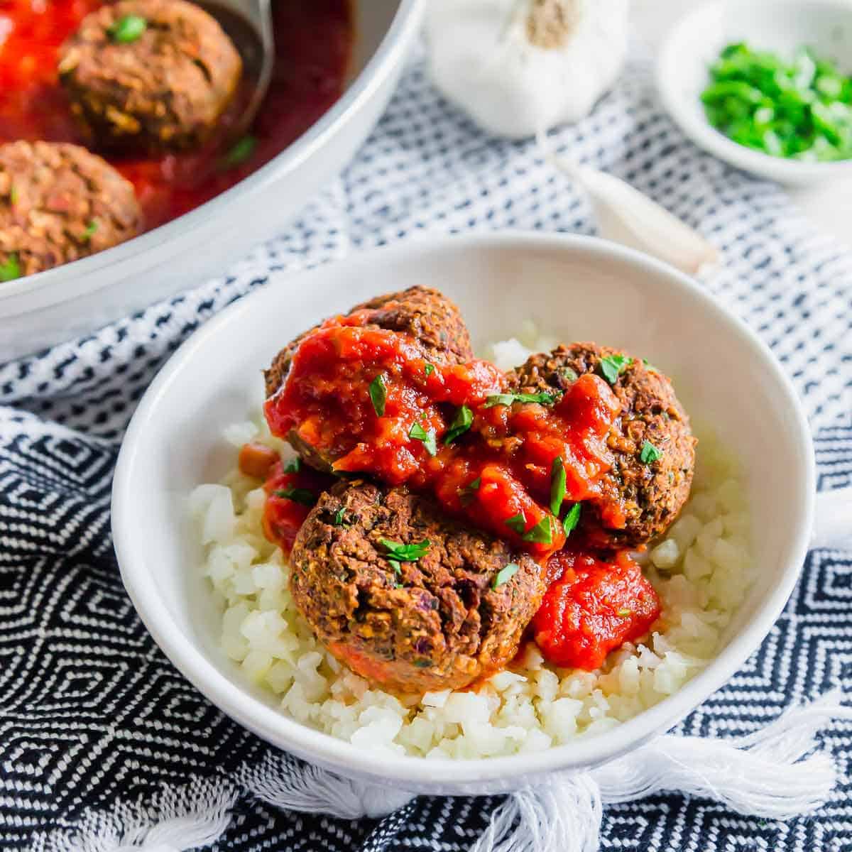 Italian seasoned black bean "meatballs" are vegan and gluten-free for a delicious plant based way to enjoy this comfort food.