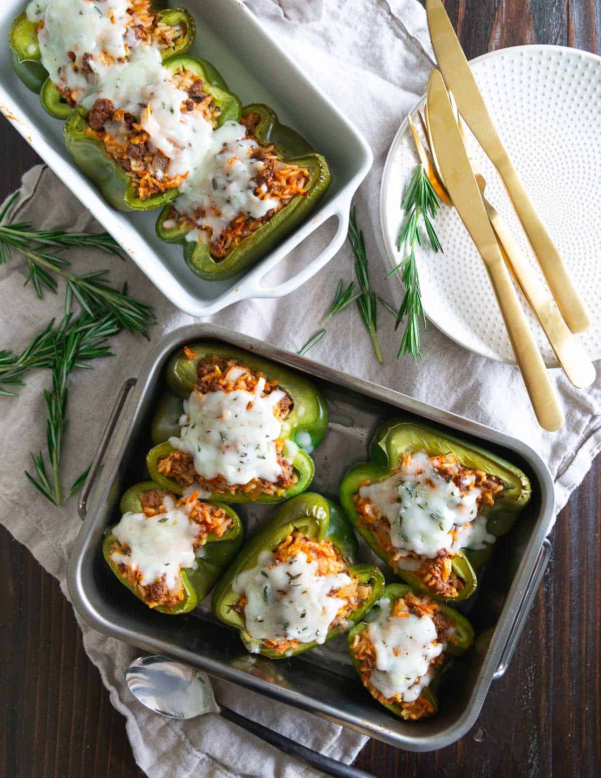 Easy stuffed pepper recipe with bison, rice and vegetables topped with melted cheddar cheese.