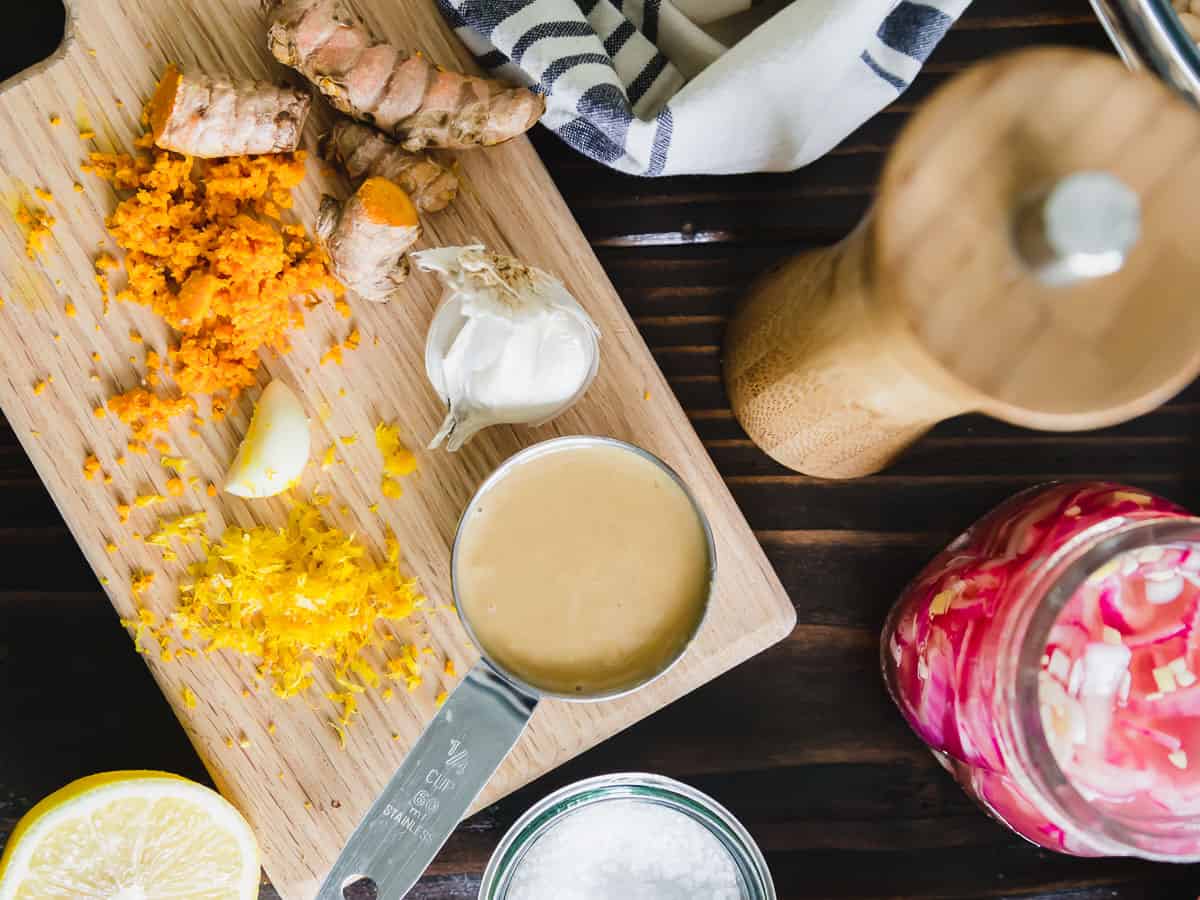 Creamy turmeric tahini dressing with garlic and lemon zest.