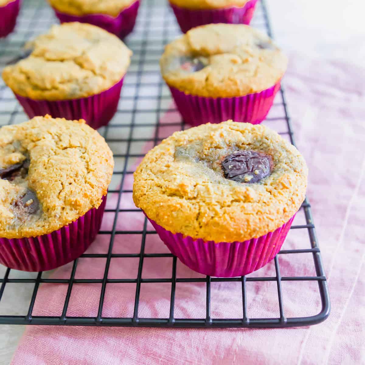 These vegan and gluten-free corn muffins are filled with whole fresh cherries and make a delicious summer baked good!