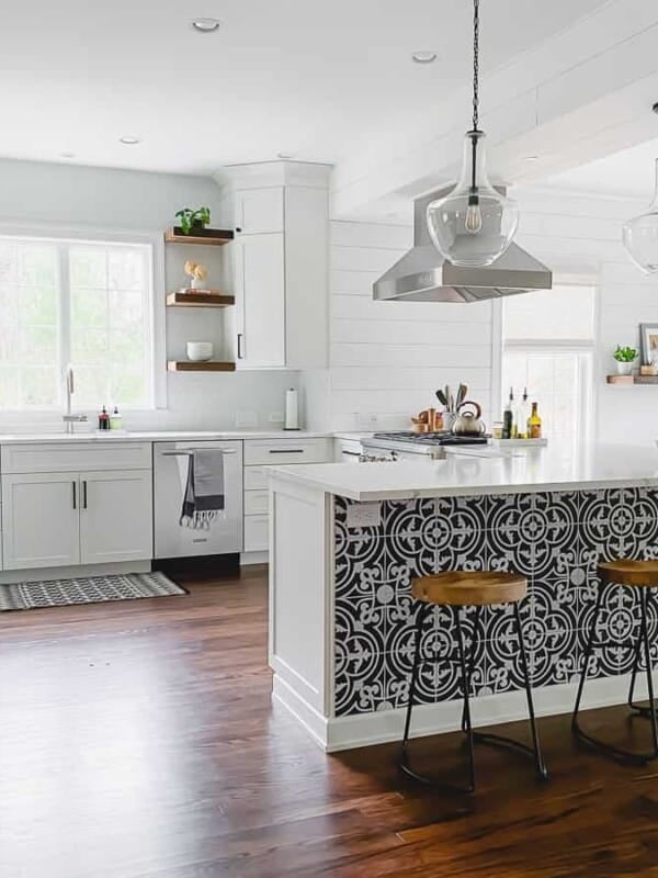 kitchen remodel with white cabinets, wood shelving and bright feel