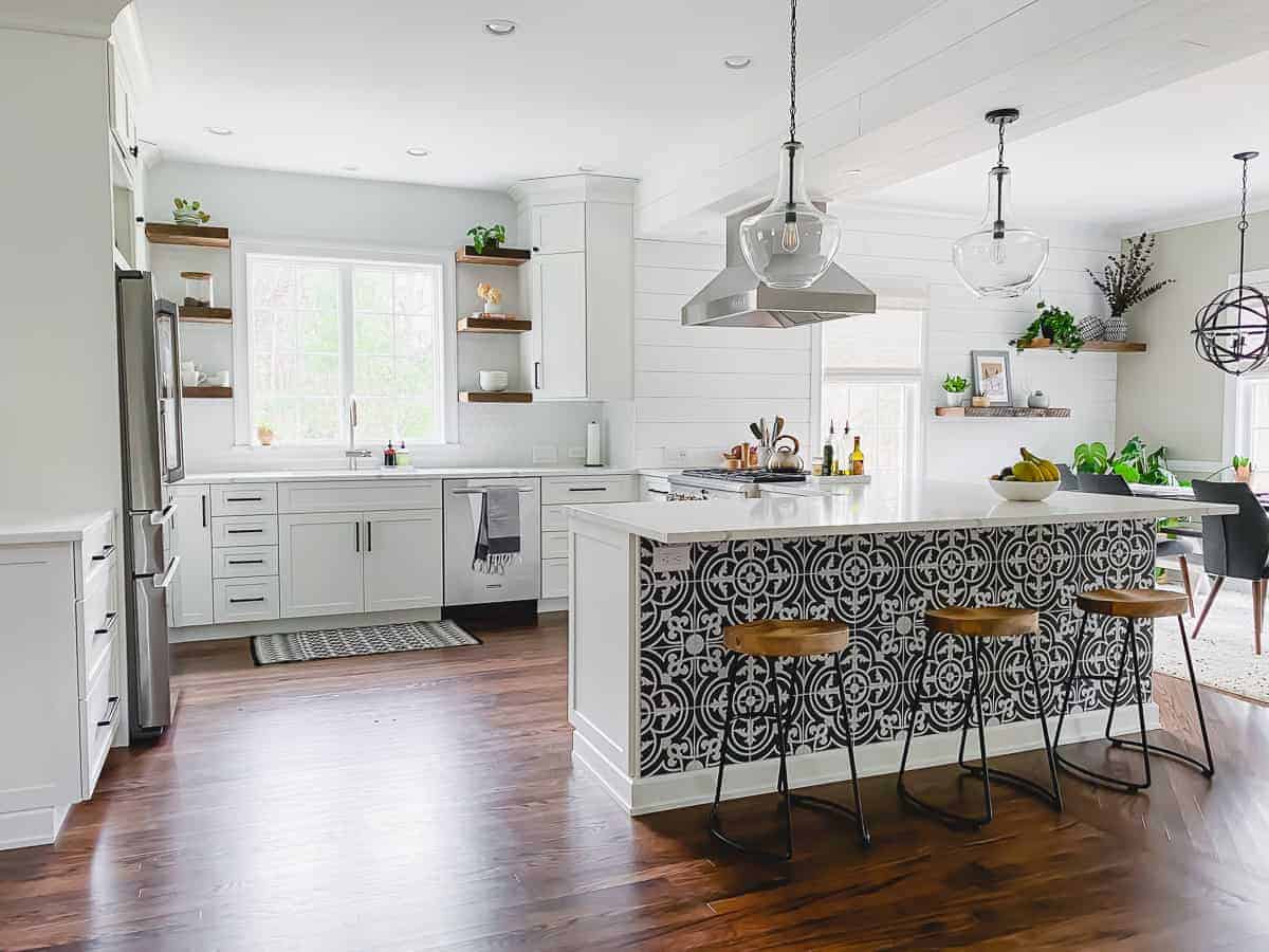 kitchen remodel with white cabinets, wood shelving and bright feel