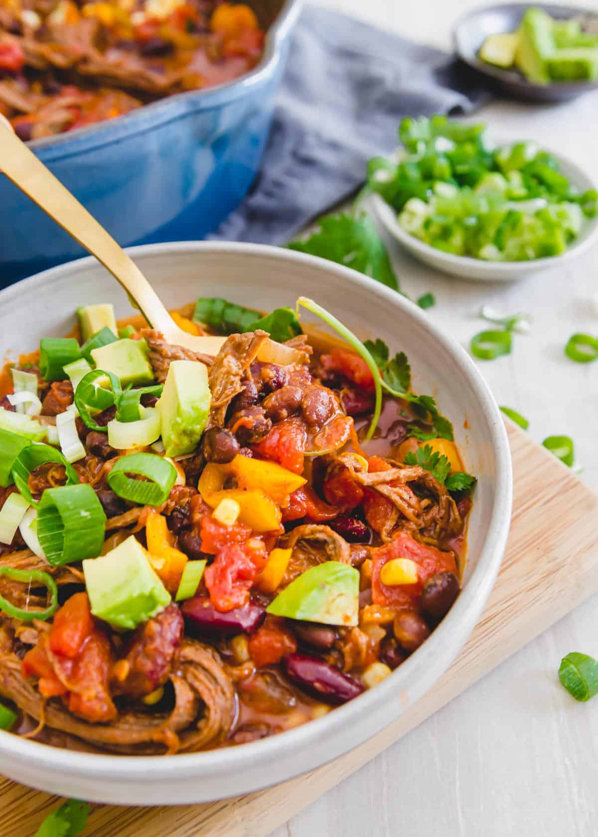Use leftover Instant Pot brisket as the base for this easy brisket chili recipe filled with beans, peppers, tomatoes and corn.