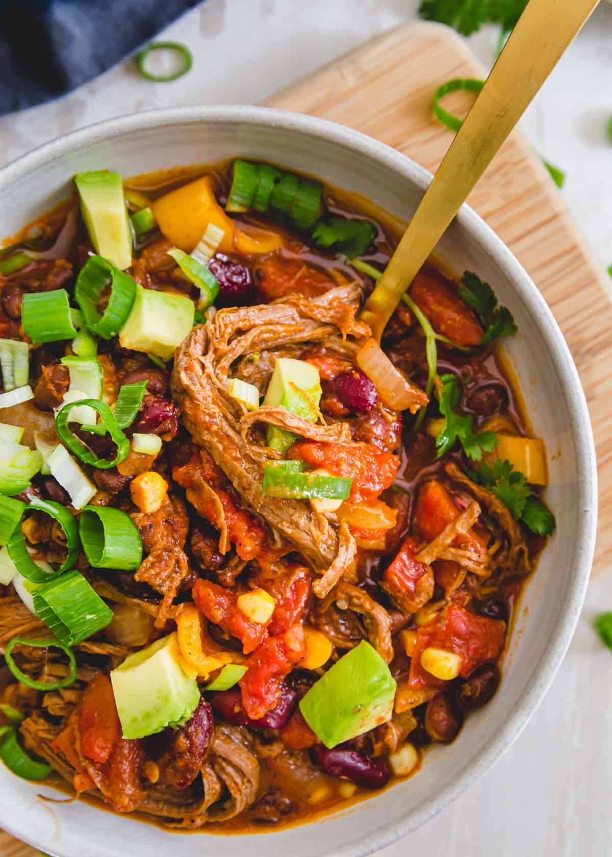 Brisket chili is a comforting, hearty meal perfect for using up leftover beef brisket in a cozy chili filled with beans, peppers and corn and a thick tomato base. 