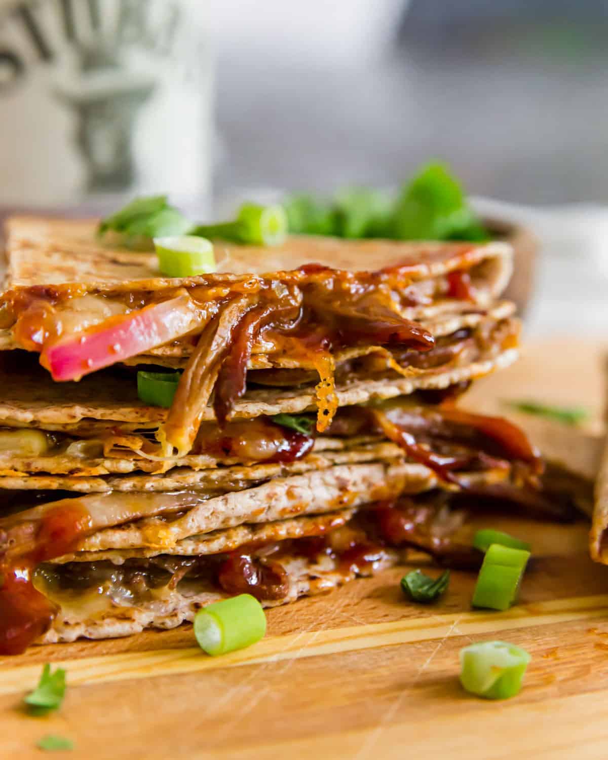 This brisket quesadilla is the ultimate way to use up brisket leftovers. Melted cheddar, red onions and smoky BBQ sauce are stuffed in a brisket filled tortilla with crispy edges and a gooey delicious center.