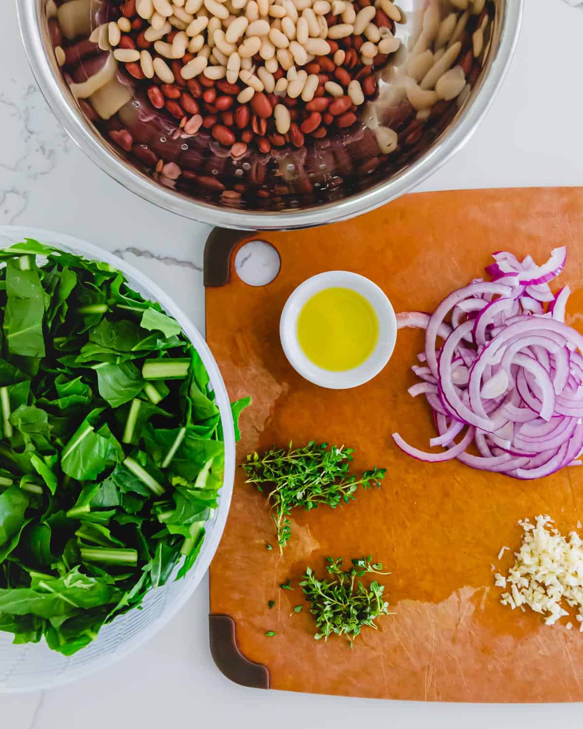 prepped ingredients for a vegetarian dandelion greens and beans skillet recipe