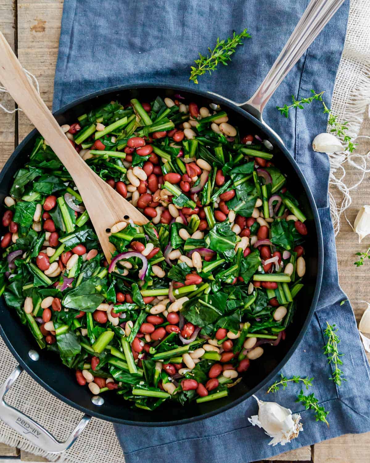 Sautéed dandelion greens with beans skillet recipe is an easy, meatless meal.