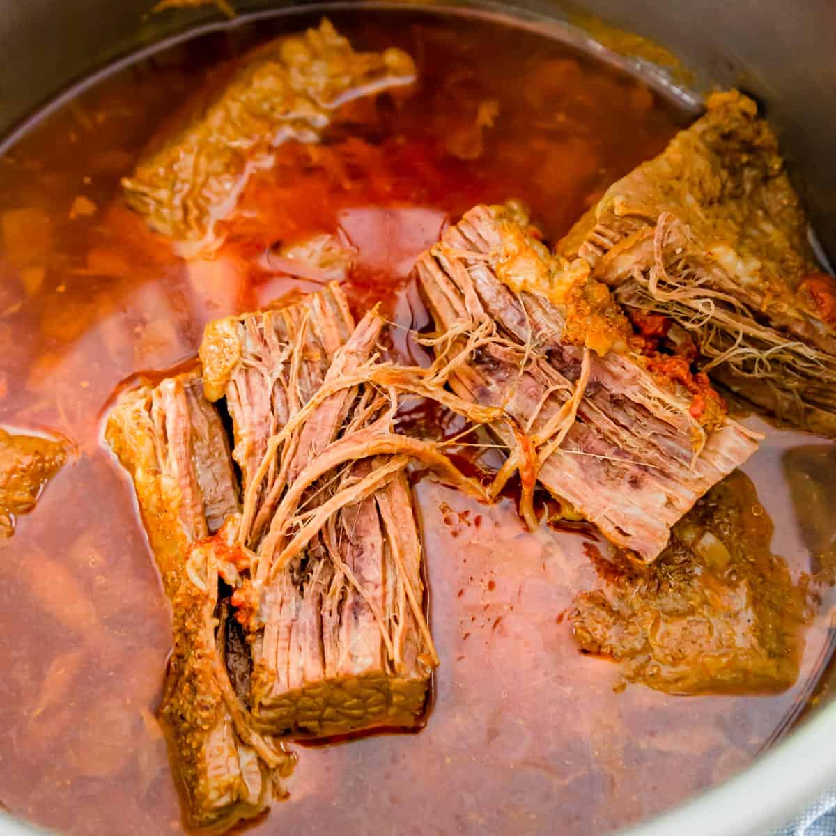 Brisket after 90 minutes of cooking in the Instant Pot is fall apart tender and juicy.