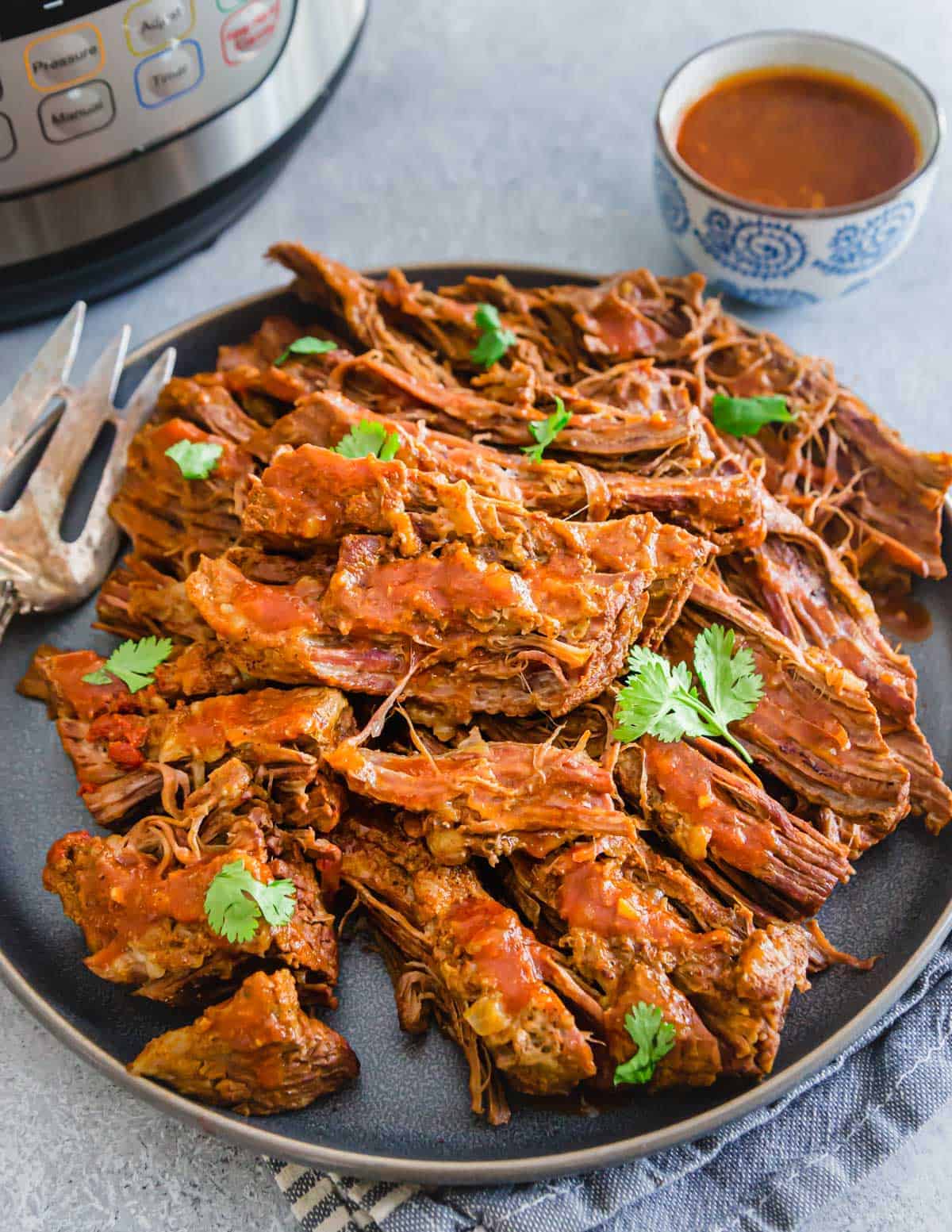 This easy recipe for brisket in an Instant Pot or pressure cooker results in a tender & juicy BBQ beef brisket everyone is sure to love!