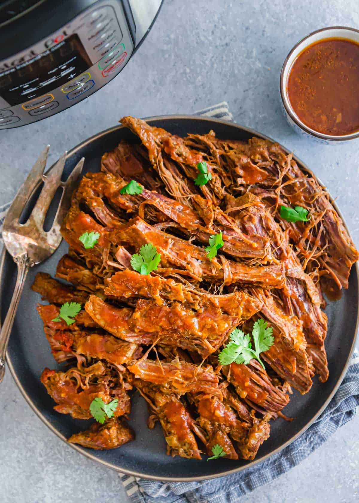 Easy Instant Pot brisket recipe with BBQ sauce.