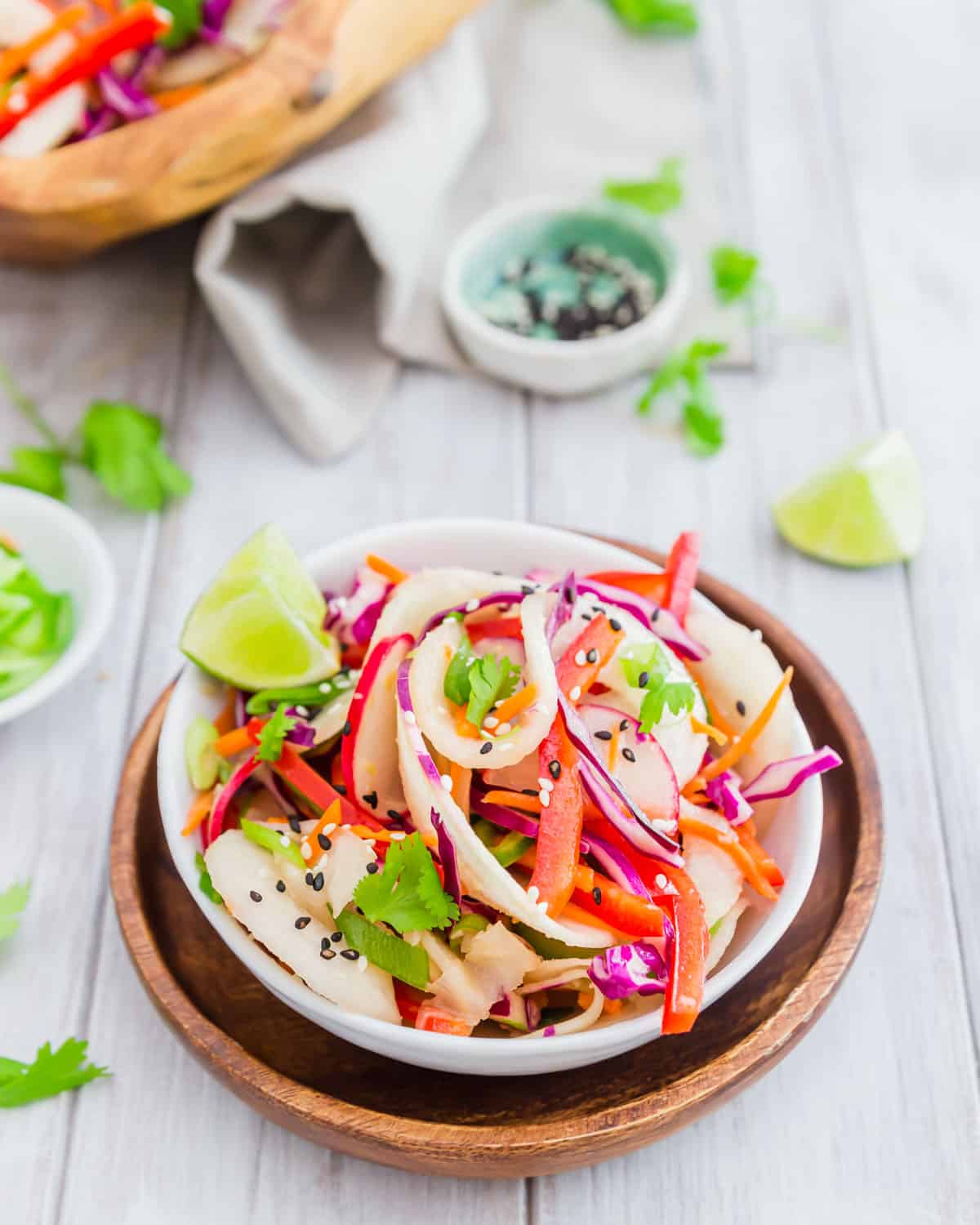 Bright colorful vegetables and kohlrabi noodles make a deliciously healthy vegetarian salad dressed with a Thai vinaigrette.