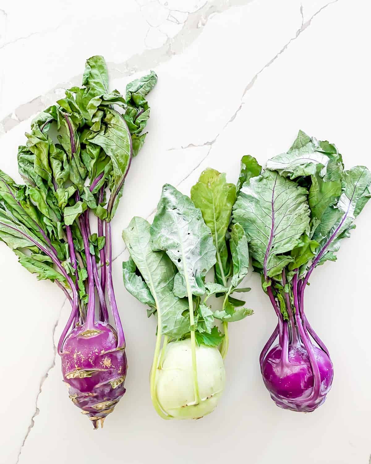 white and purple kohlrabi with stems