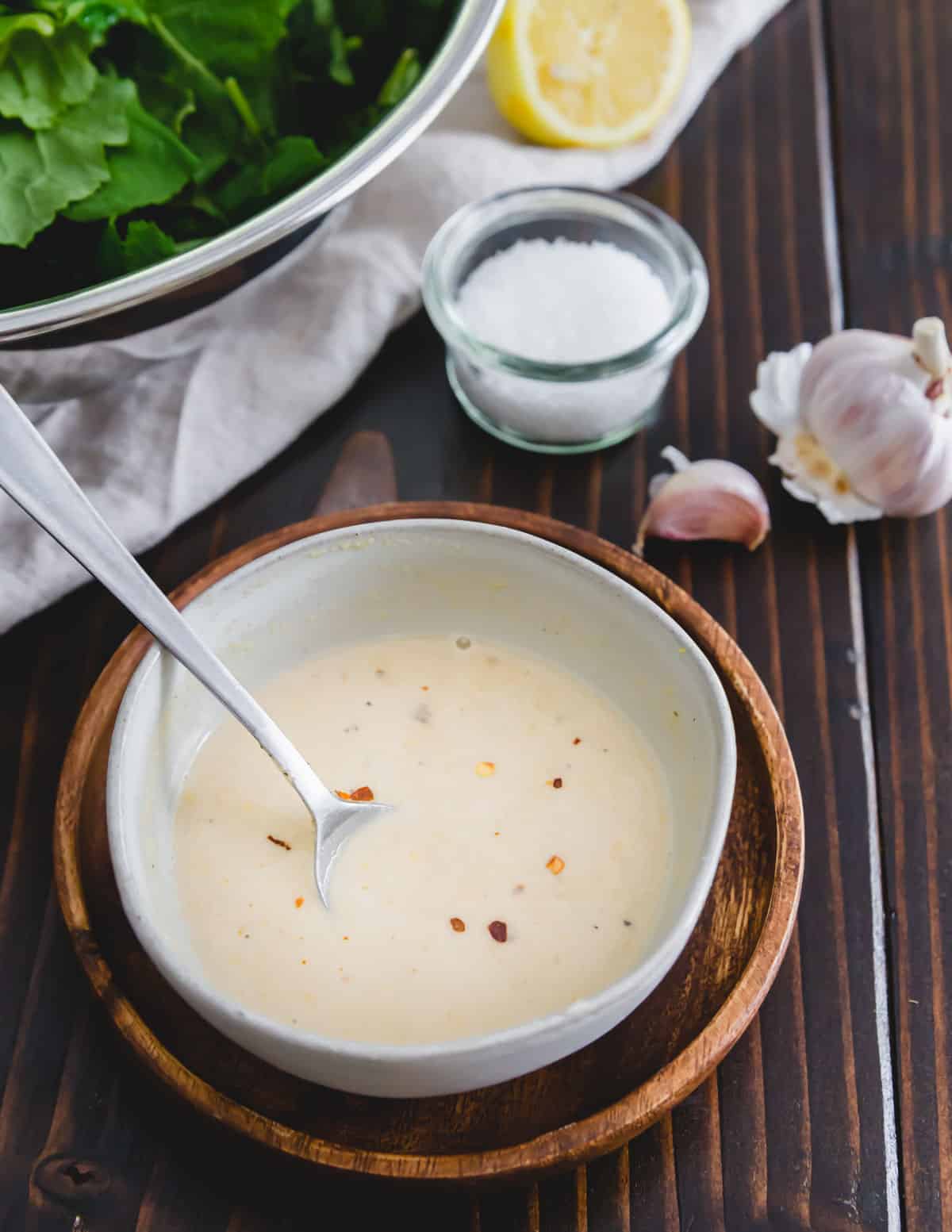 Make this easy tahini dressing with lemon juice, garlic and nutritional yeast to toss with the baby kale salad.