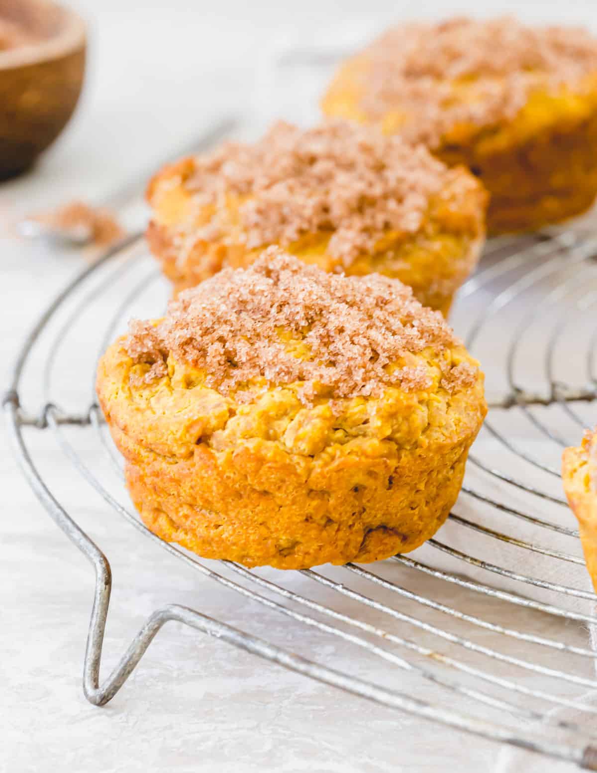 Gluten free pumpkin muffins topped with cinnamon sugar are a deliciously easy fall treat.