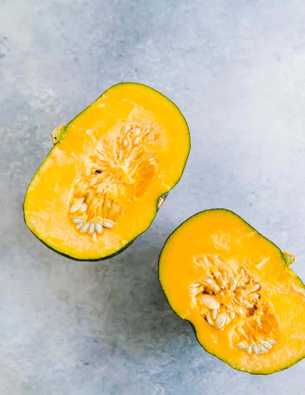 Buttercup squash sliced in half with the seeds still intact.