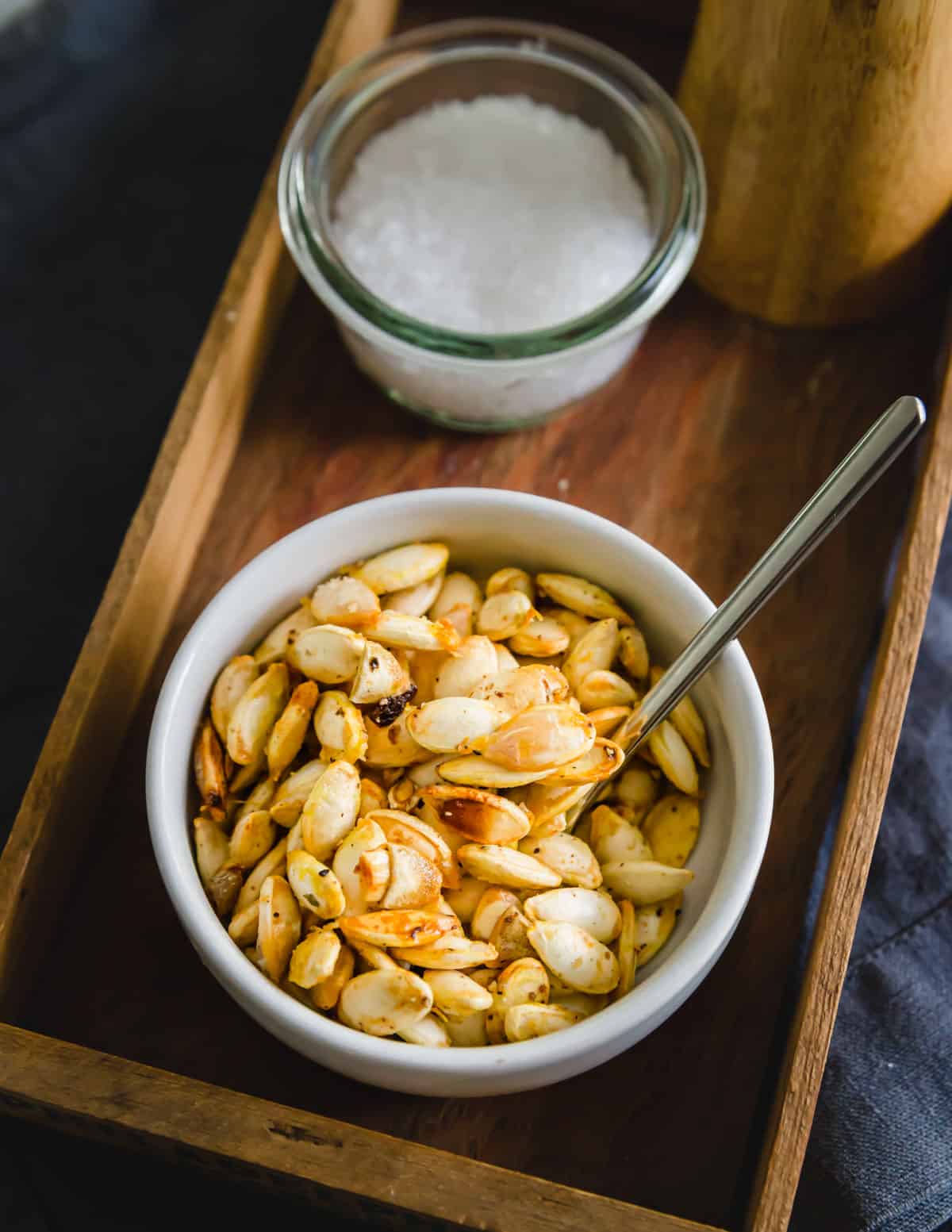 Crispy, golden roasted winter squash seeds seasoned with olive oil, salt and pepper