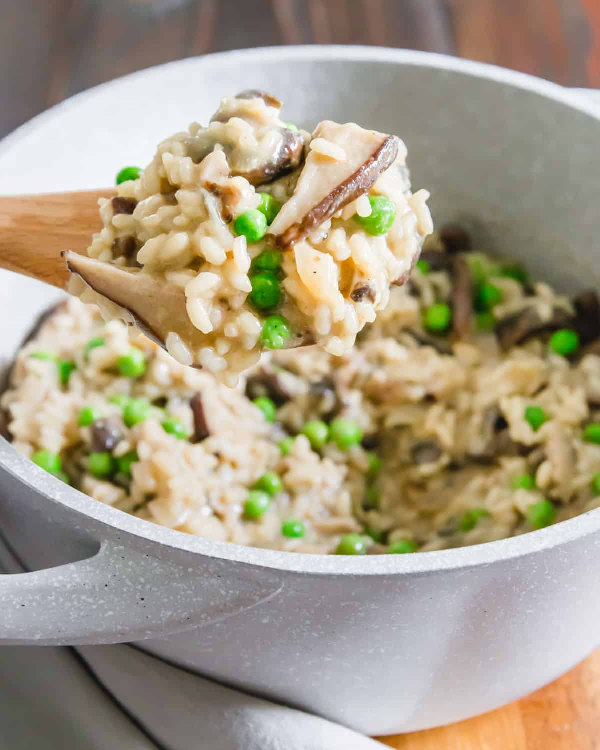 Dairy free, creamy vegan risotto with mushrooms and peas.
