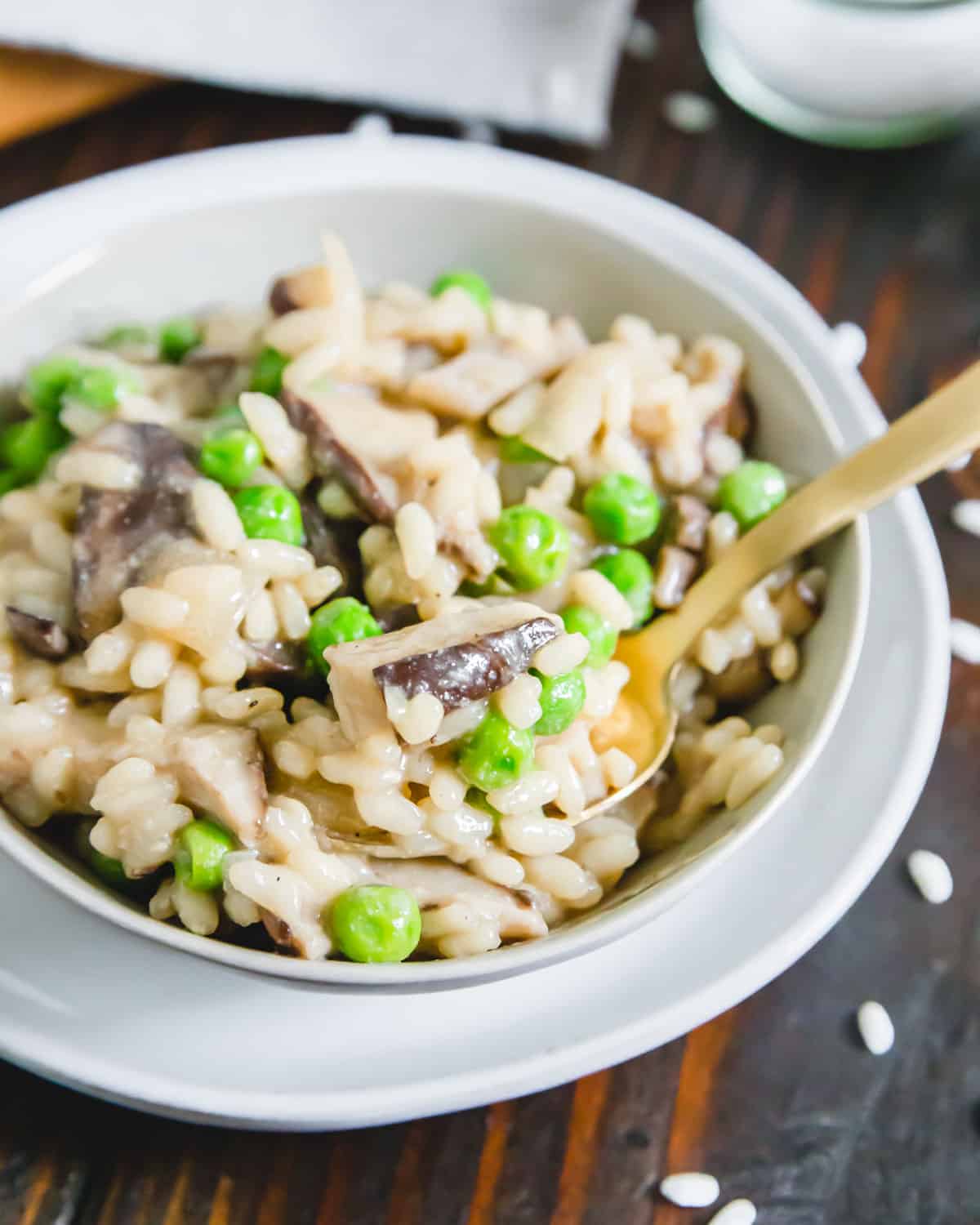 Dairy-free, gluten-free, vegan mushroom risotto with peas and nutritional yeast